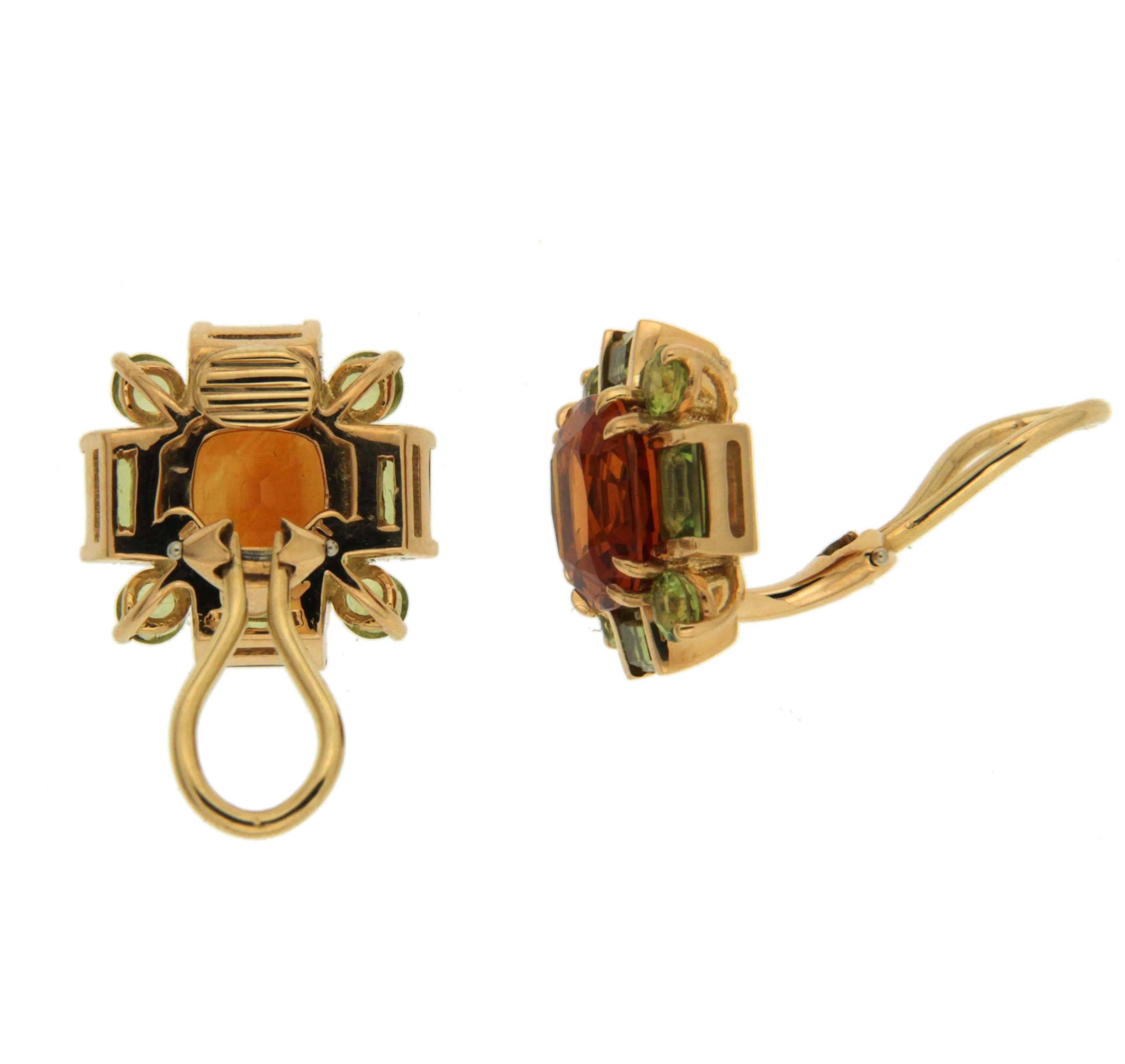 These earrings are made in 18kt yellow gold, they feature cushion cut citrine stone in the center and round and baguette peridot stones all around, they are finished with clip-backs.

Citrines total weight 8.28 ct
