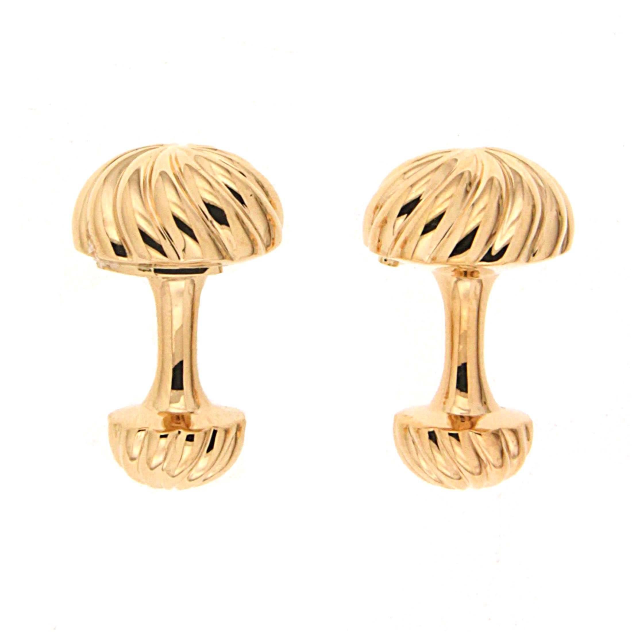 Textured 18k yellow gold is the highlight of these cufflinks. The motif is a fluted dome topped with a star shape. As the grooves travel downwards, they curve to make a swirl. A similar, smaller dome makes up the reverse side. In between is a
