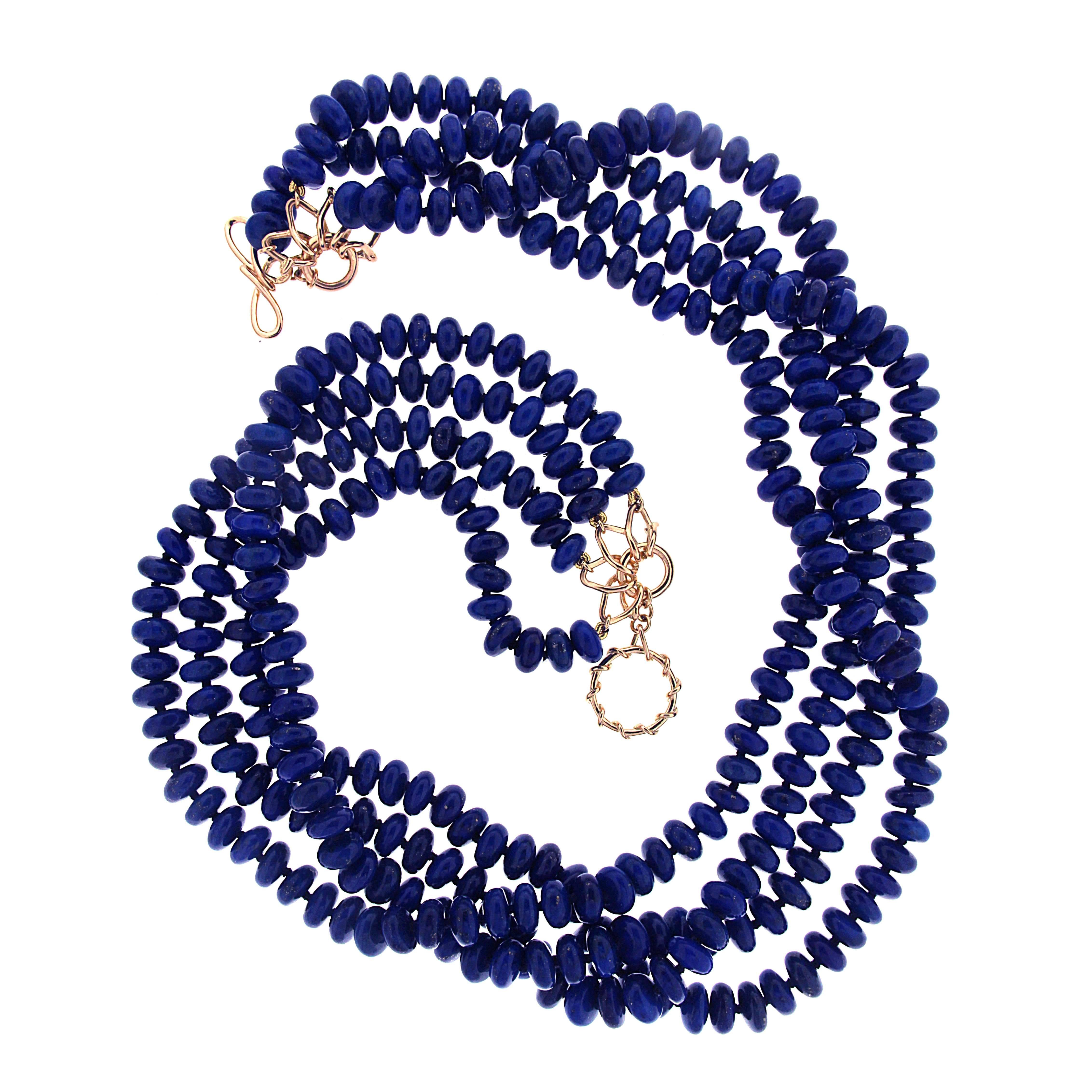 This necklace features 4 strands of 8.2mm round lapis lazuli roundels. It is finished with 18kt yellow gold knot and toggle clasp.