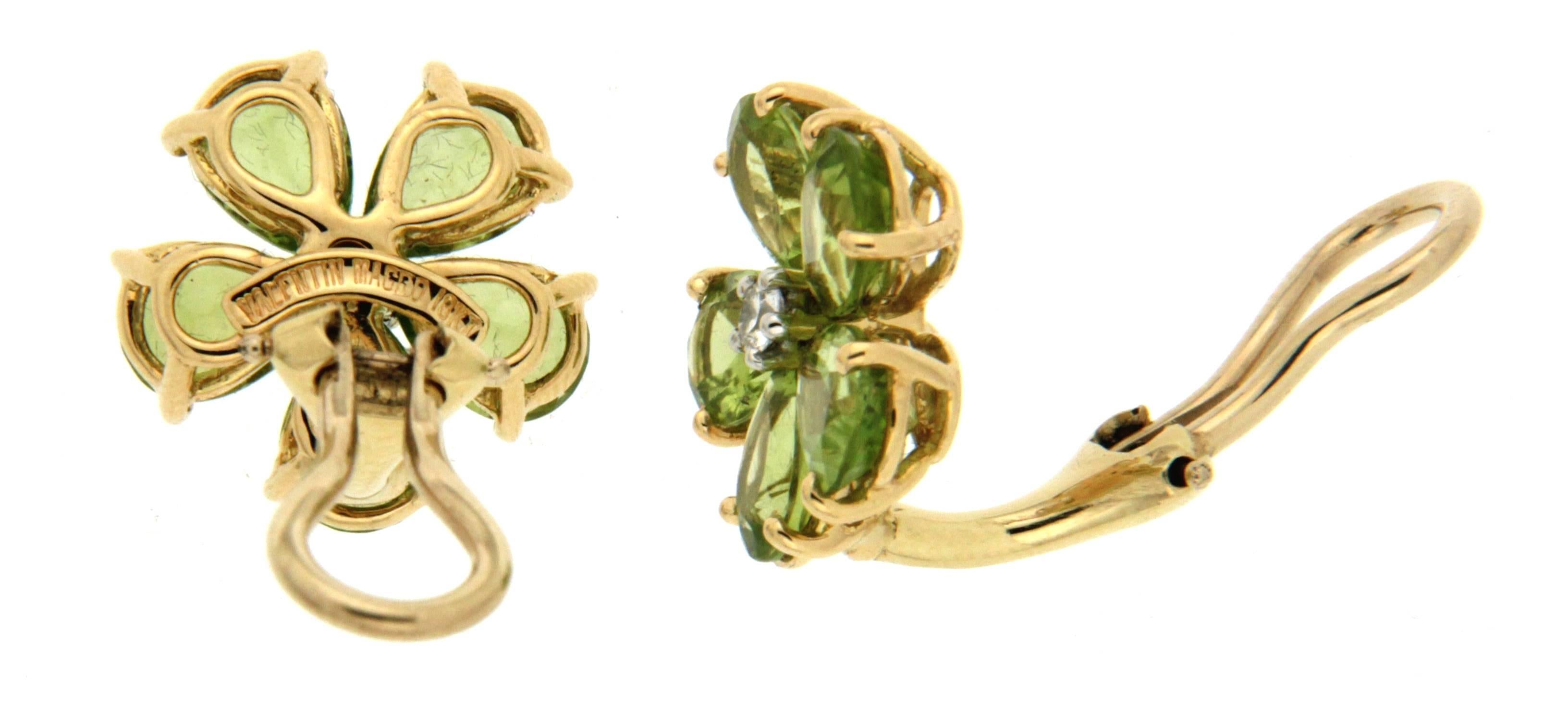 For decades, Valentin Magro's fine jewelry creations have illuminated the most special of occasions. These earrings are made in 18kt yellow gold with expert selected pear shaped Peridots that match perfectly in color and shades. The earrings have a
