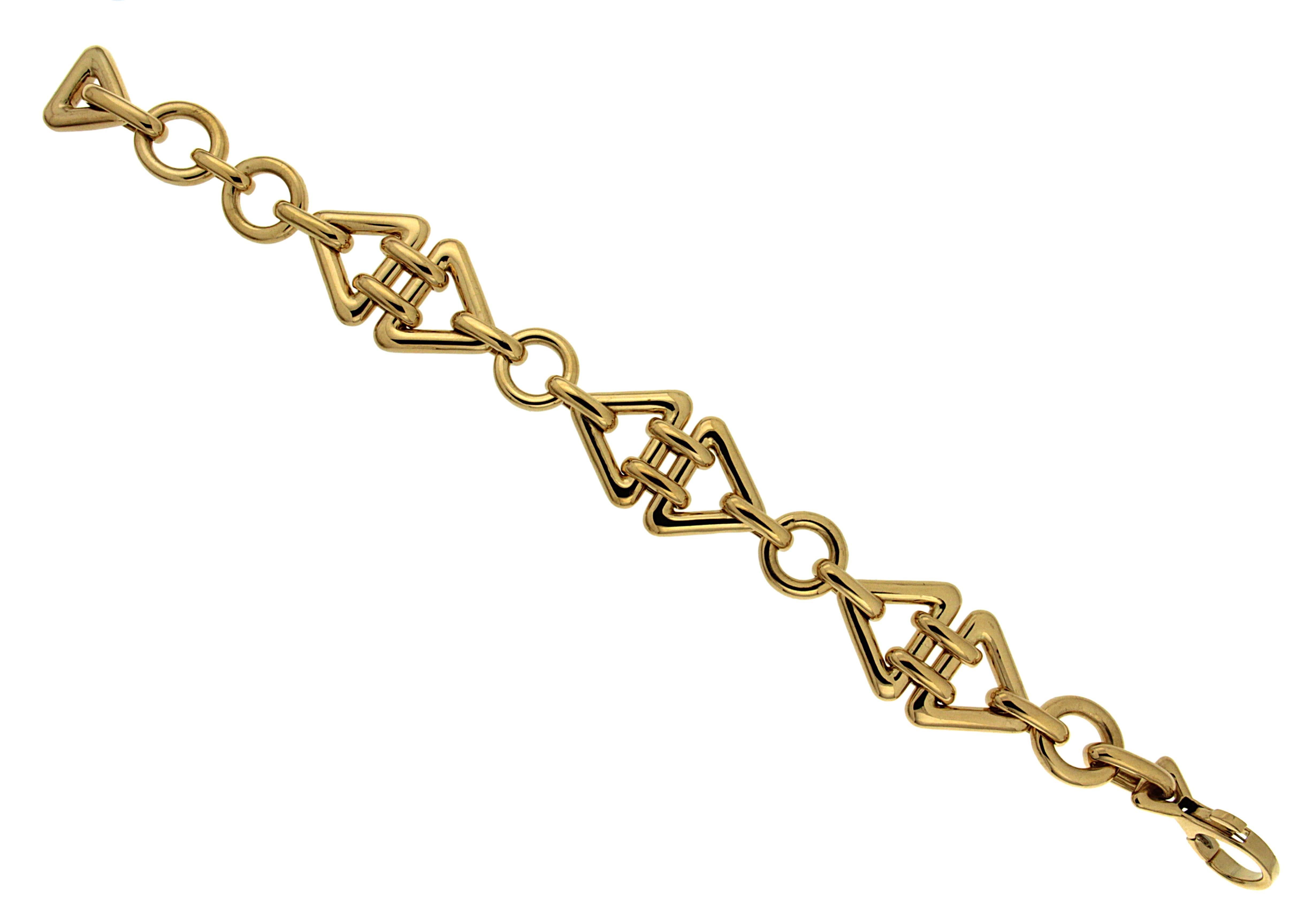 For decades, Valentin Magro's fine jewelry creations have illuminated the most special of occasions. This geometric bracelet features double oval links connects two triangle shape links with round links in between. The bracelet is completed in 18kt