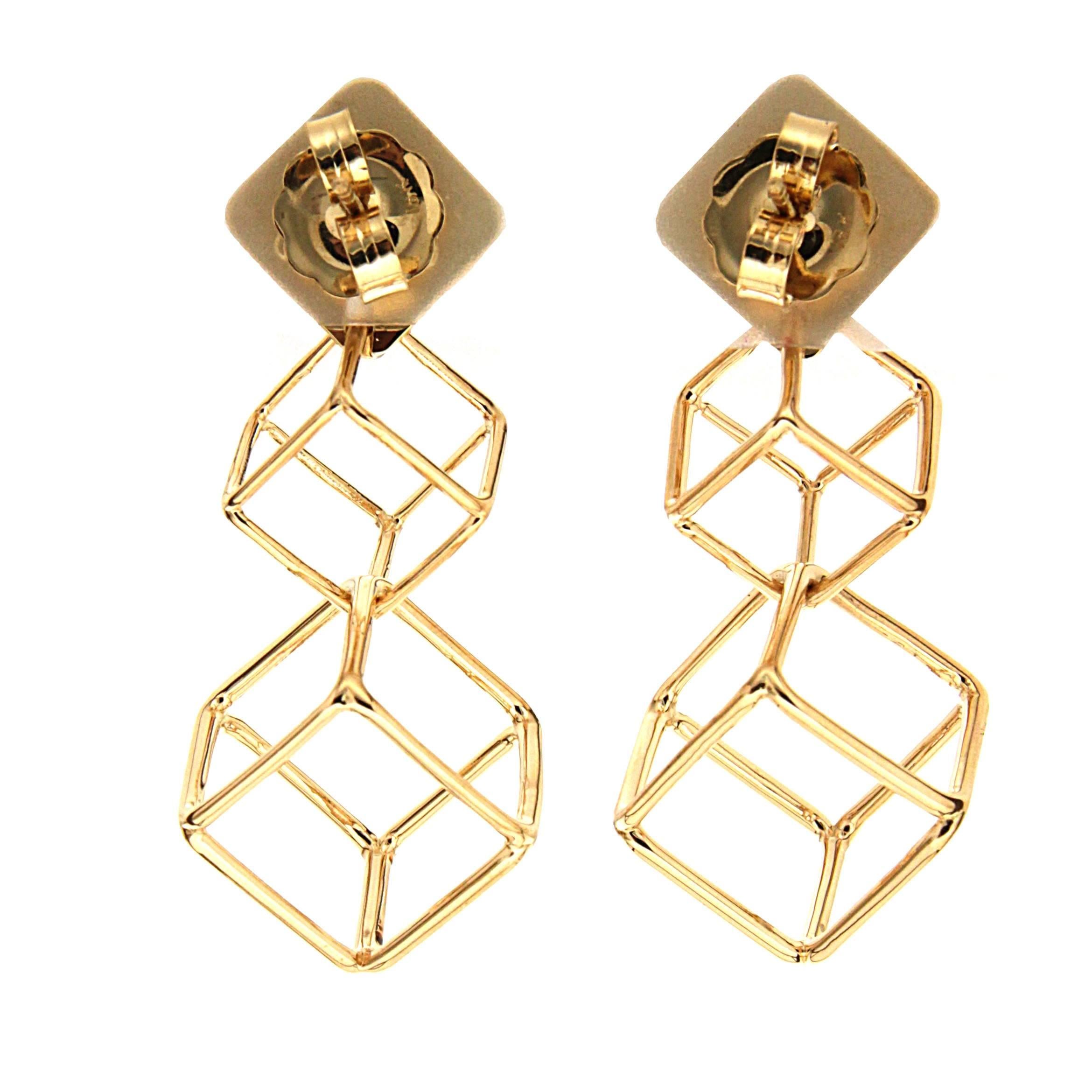 This pair of Cushion Cube dangling Earrings features two cubes and is finished in 18kt Yellow gold with jumbo friction backs