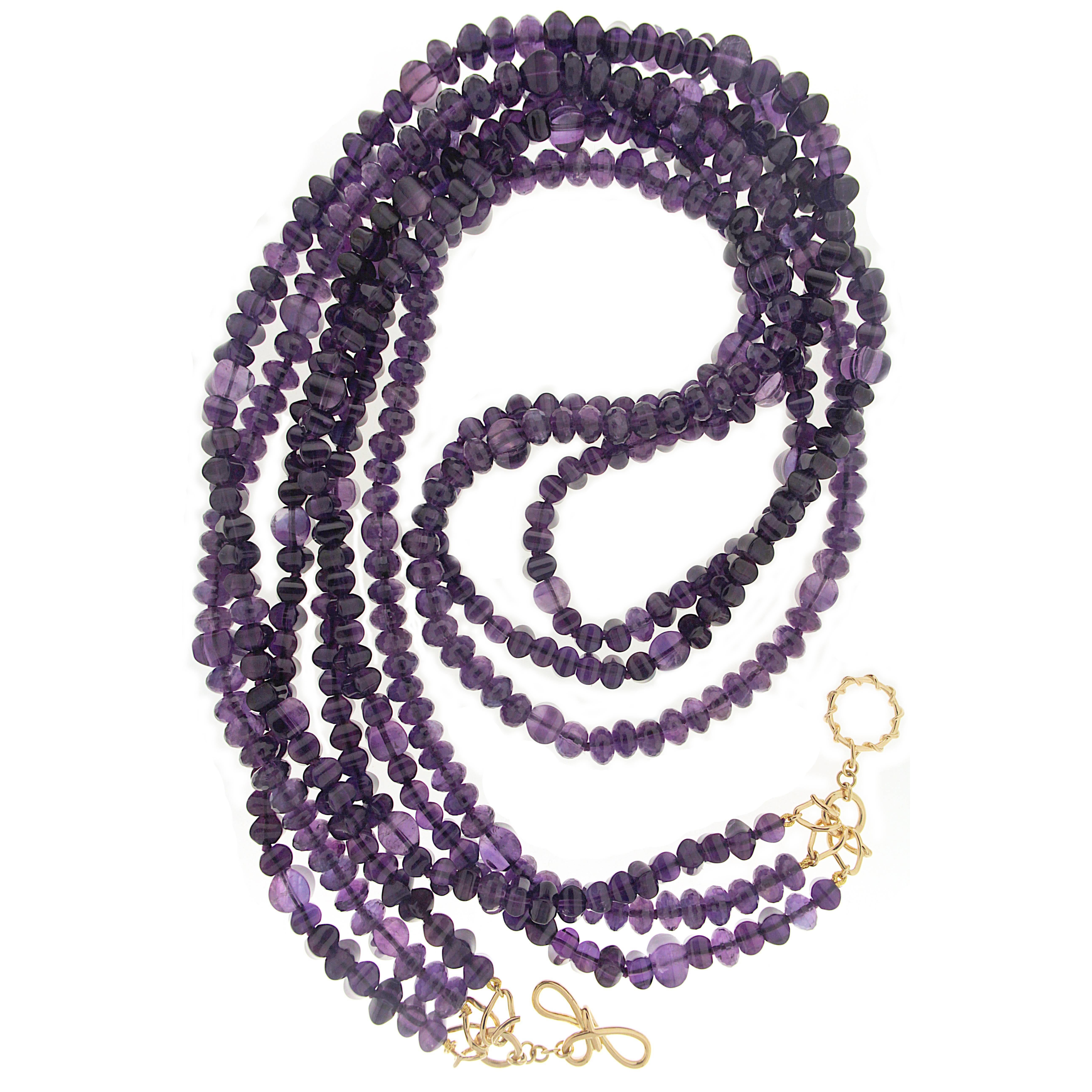 This necklace features three strands of Amethyst Cube Sugar Loaf & Roundel with 18kt yellow gold wire knot and wire link toggle.