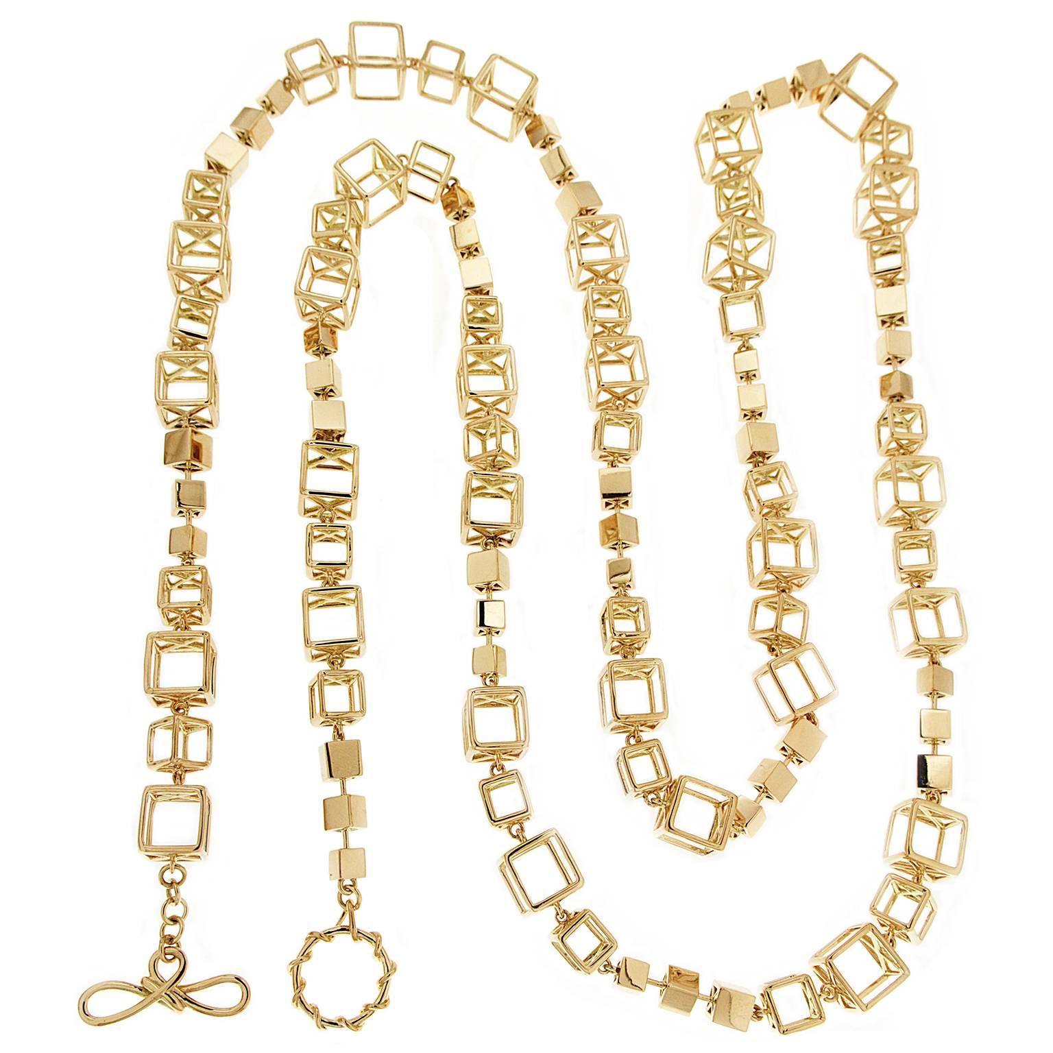 This unique necklace features large, medium and small cube links and solid turning cube connectors. This necklace can be worn as a single long necklace or wrap twice around the neck as a 2 layers necklace. The necklace is completed in 18kt yellow