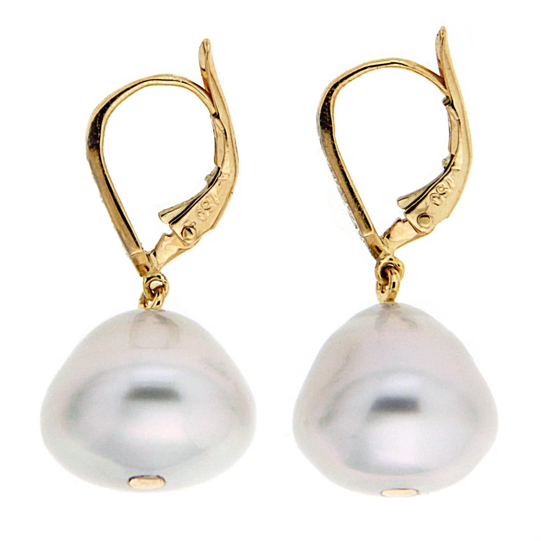 Baroque white South Sea pearls drop earrings with diamonds and lever back in 18kt yellow gold.