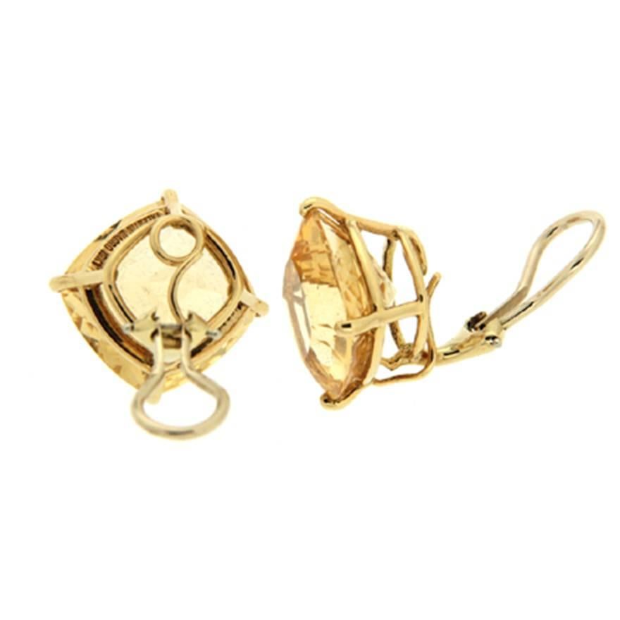 These citrine earrings feature an unusual cut. Cushion cuts are faceted stones with a shape between a square and an oval. These are also checkerboard cut, with many square facets in a grid pattern to create a distinctive luster. The two gems are