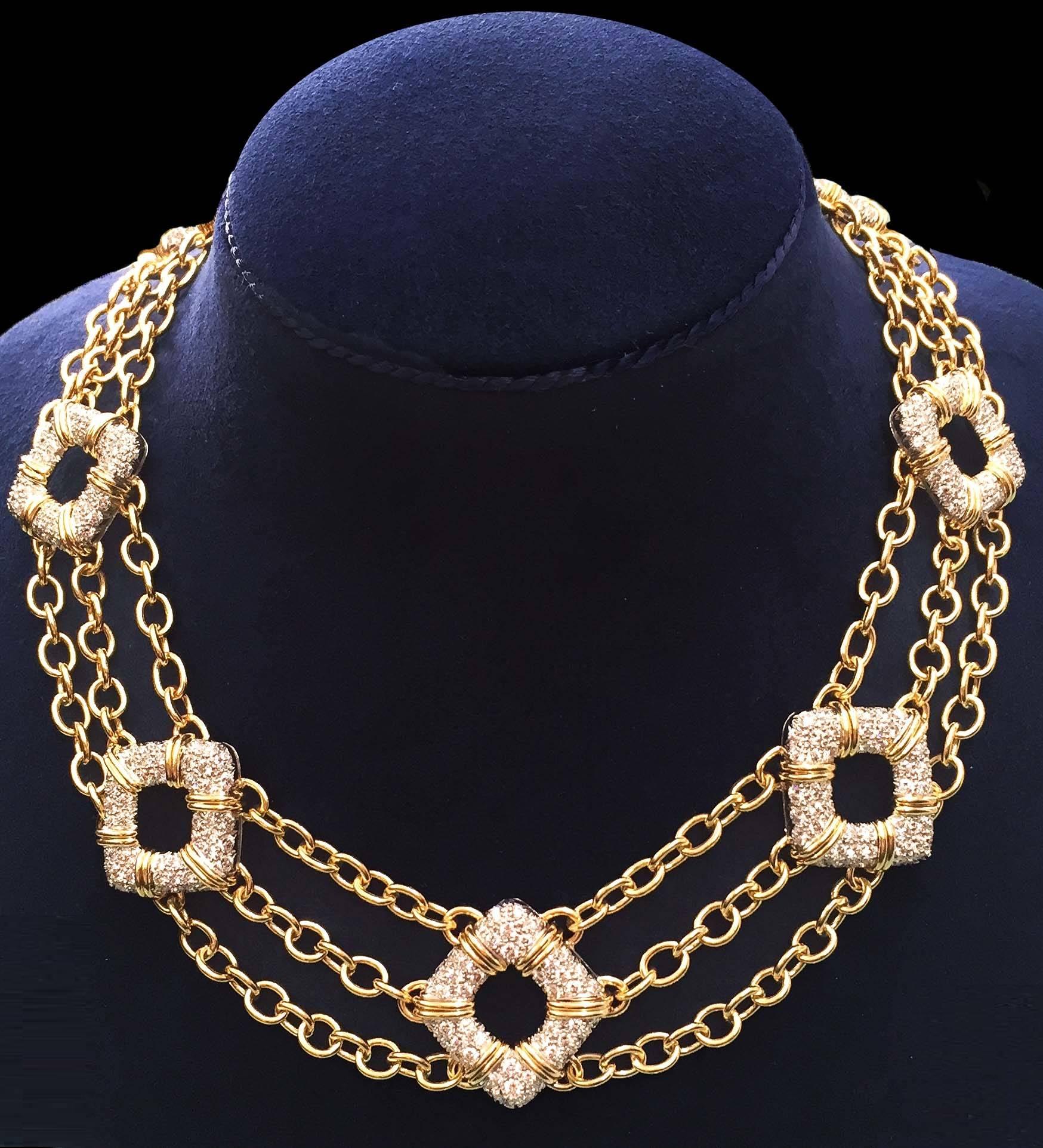 For decades, Valentin Magro's fine jewelry creations have illuminated the most special of occasions. This magnificent necklace features 7 Nautical motif sections with round brilliant diamonds linked with triple gold chains of oval links and is