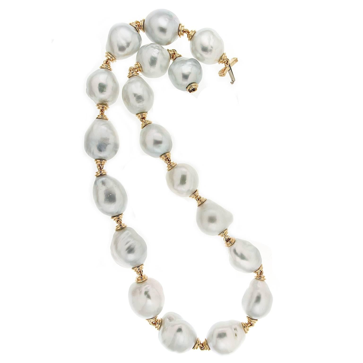 This necklace features 18 South Sea Baroque pearls with 18kt yellow gold connectors amd clasps. The pearl size ranges from 20.7 x 18.3 mm to  18.2 x 16.7 mm.
