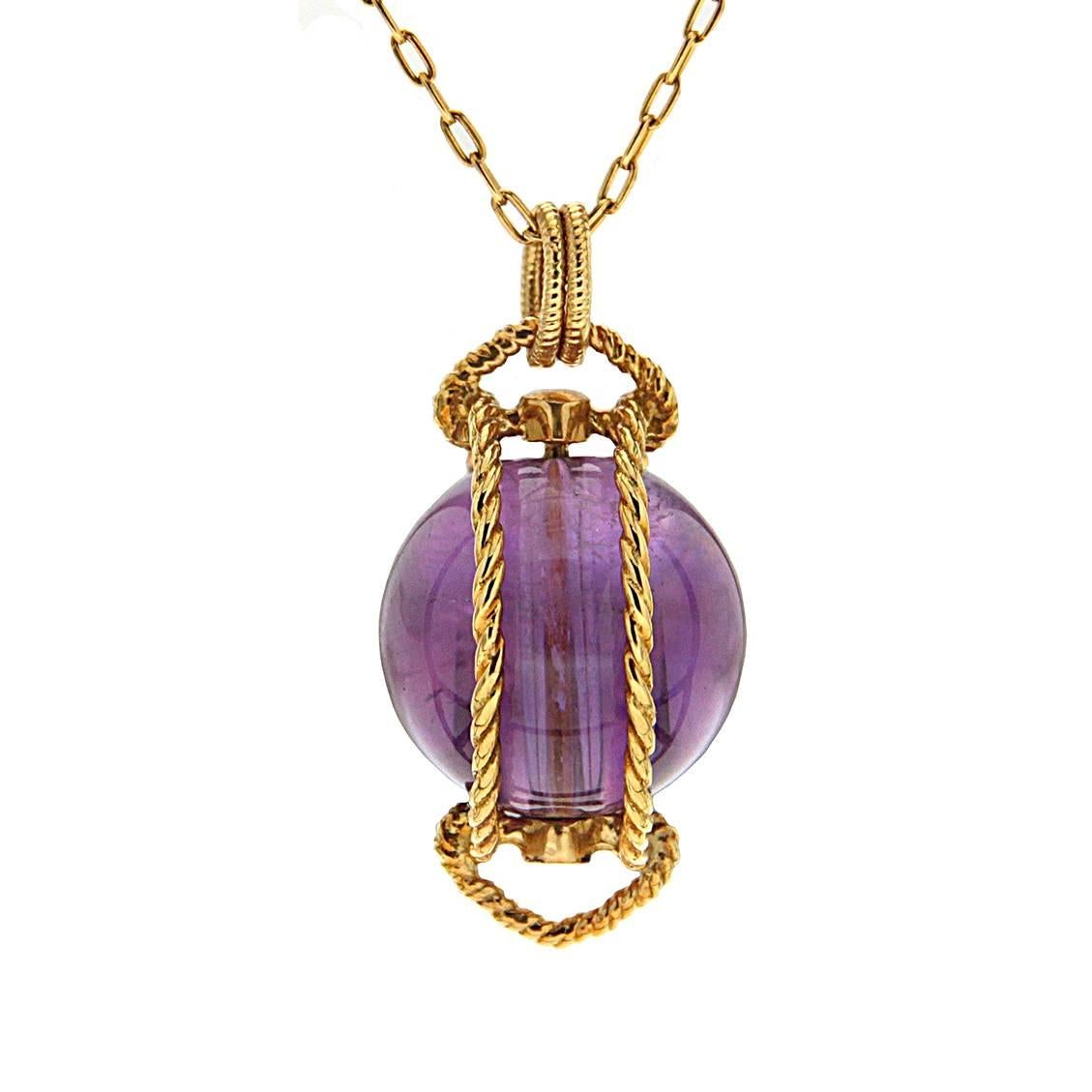 This lovely amethyst pendant (12.5mm) ball with a polished finish is wrapped around by 18kt gold rope wires. Light in weight and small in size. The chain is 18 inch (chain can be resize upon request).  