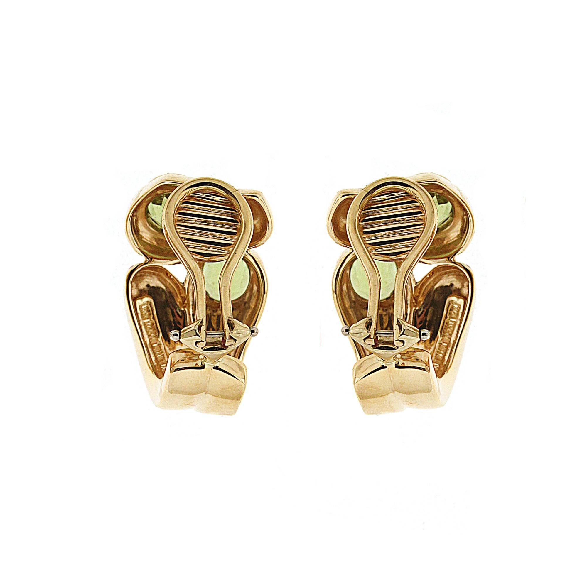 For decades, Valentin Magro's fine jewelry creations have illuminated the most special of occasions. These earrings are made in 18kt yellow gold they feature four round faceted peridot stones and are finished with clip-backs. Matching Rings also