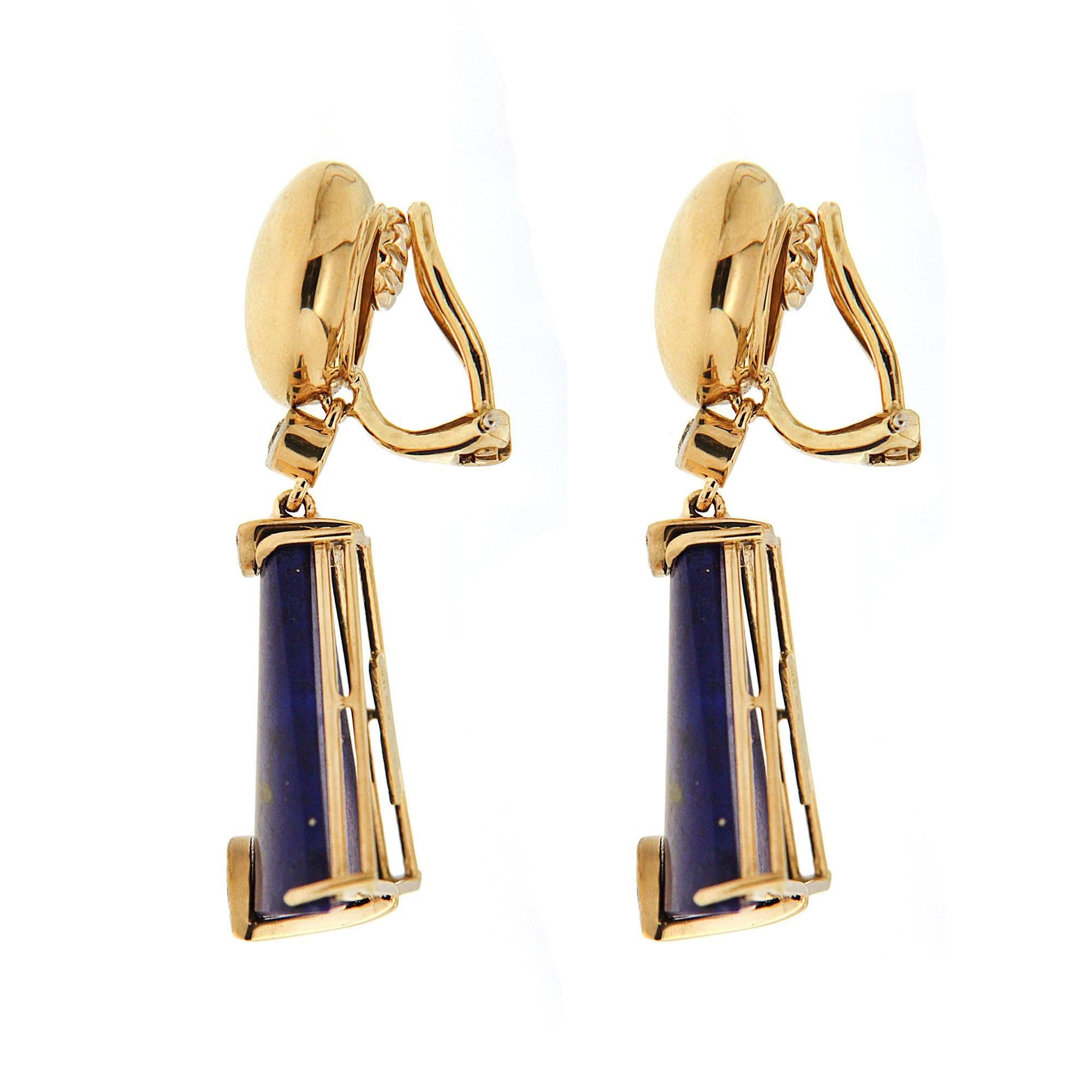 One of the most unique jewelry designs, this pair of earrings features special cut Lapis Lazuli with pave diamonds set with round motif top and clip backs in 18kt yellow gold. The result is a unique jewel and the perfect gift for any occasion.