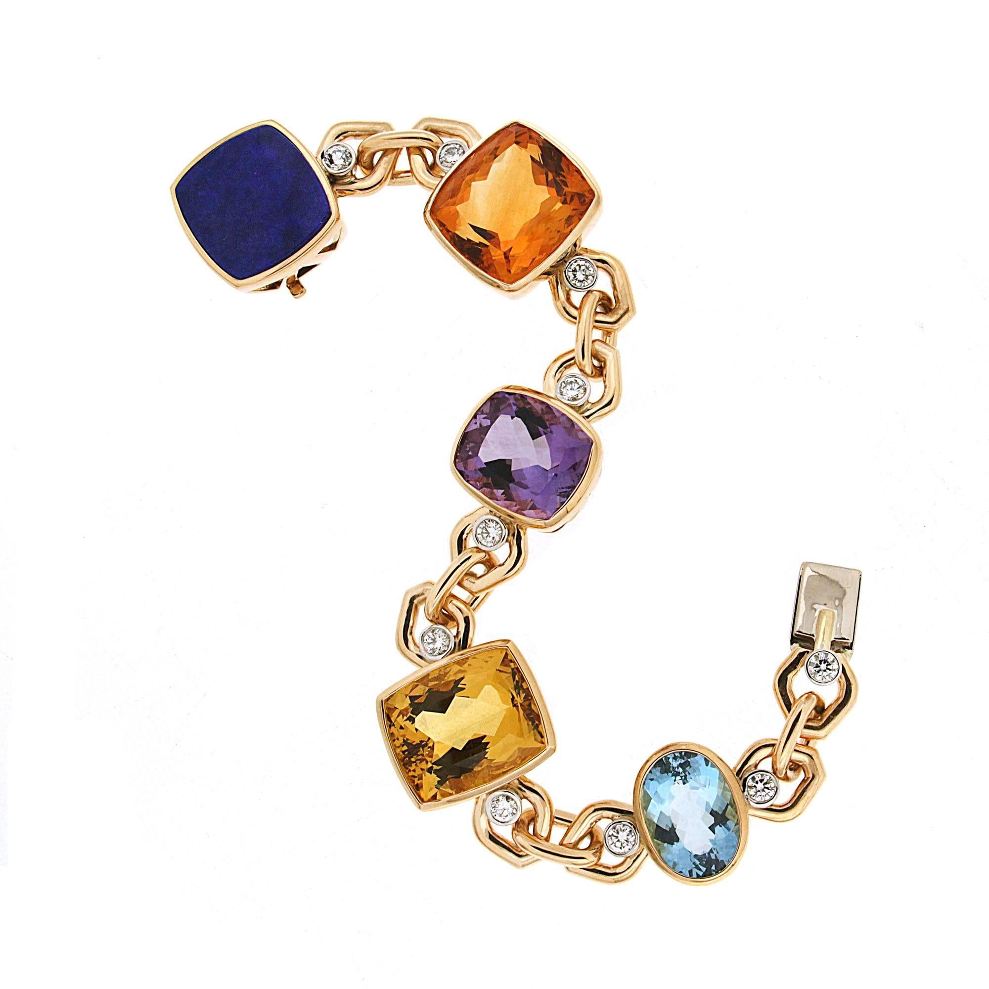 This unique multi-color gemstone link bracelet features Cushion Maderia Citrine, Yellow Beryl, Amethyst, Oval Aquamarine and Lapis Lazuli with round brilliant diamonds in 18kt yellow gold. 