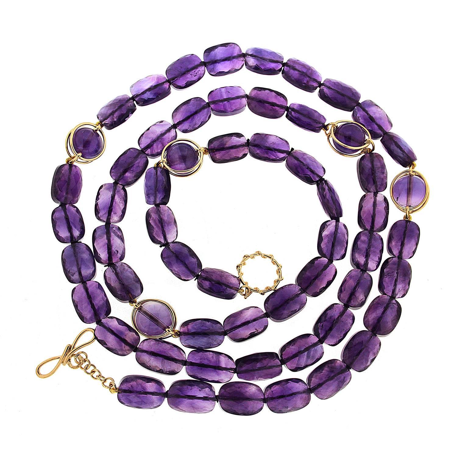 This lovely necklace features faceted Amethyst with 5 Doppio amethyst ball sections. The necklace is 40 inches long with knot and toggle clasp in 18kt yellow gold.