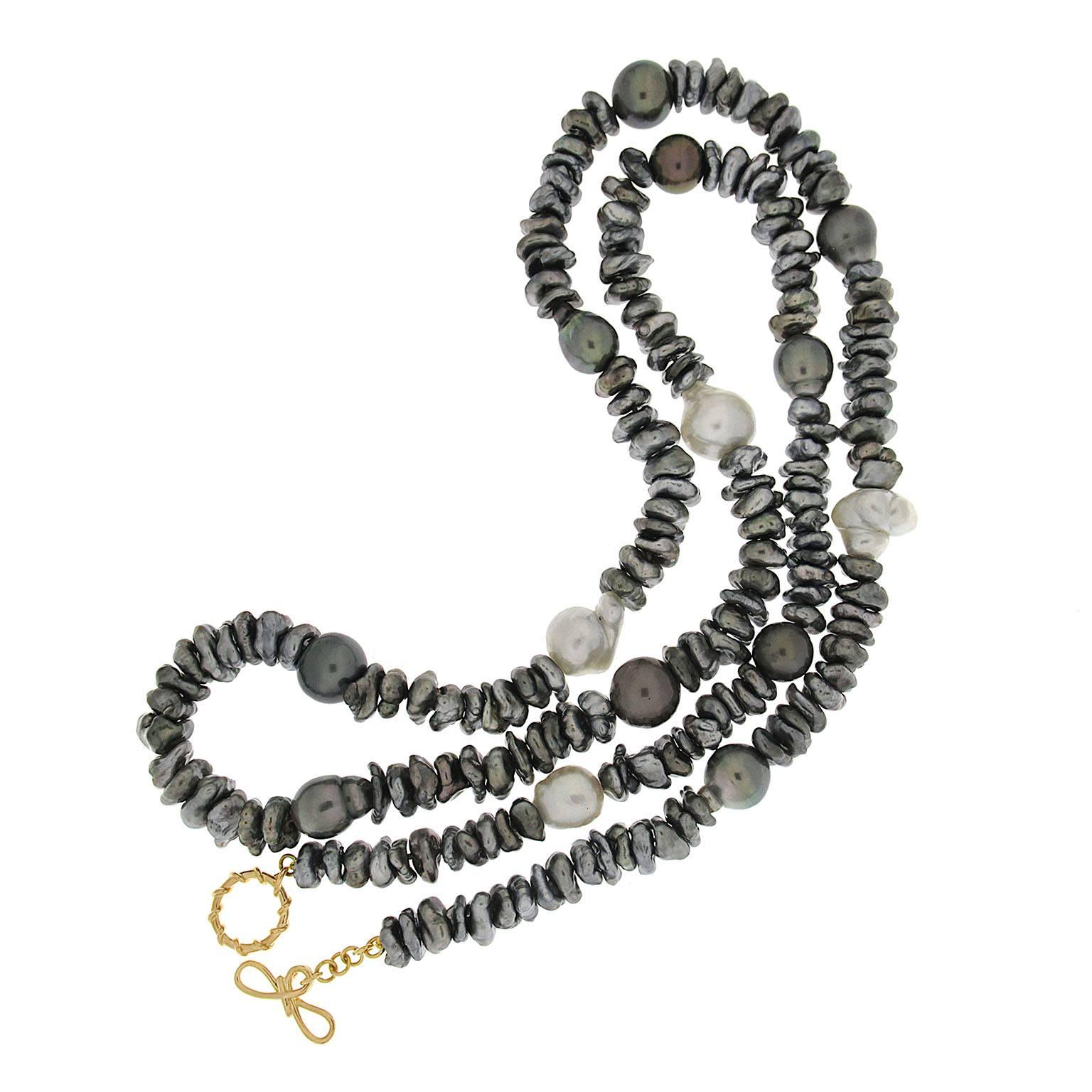 This lovely necklace features 10 Baroque Pearls and 4 South Sea Pearls and 86 Keshi Tahitian Pearls with Valentin Magro Signature knot clasp and toggle in 18kt yellow gold. 