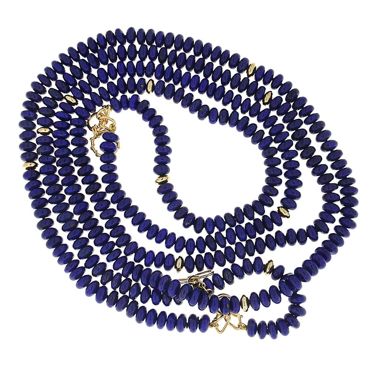 This necklace features two strands of Lapis Lazuli rondelle beads and Gold rondelles with Link toggle and wire knot clasps in 18kt yellow gold. 