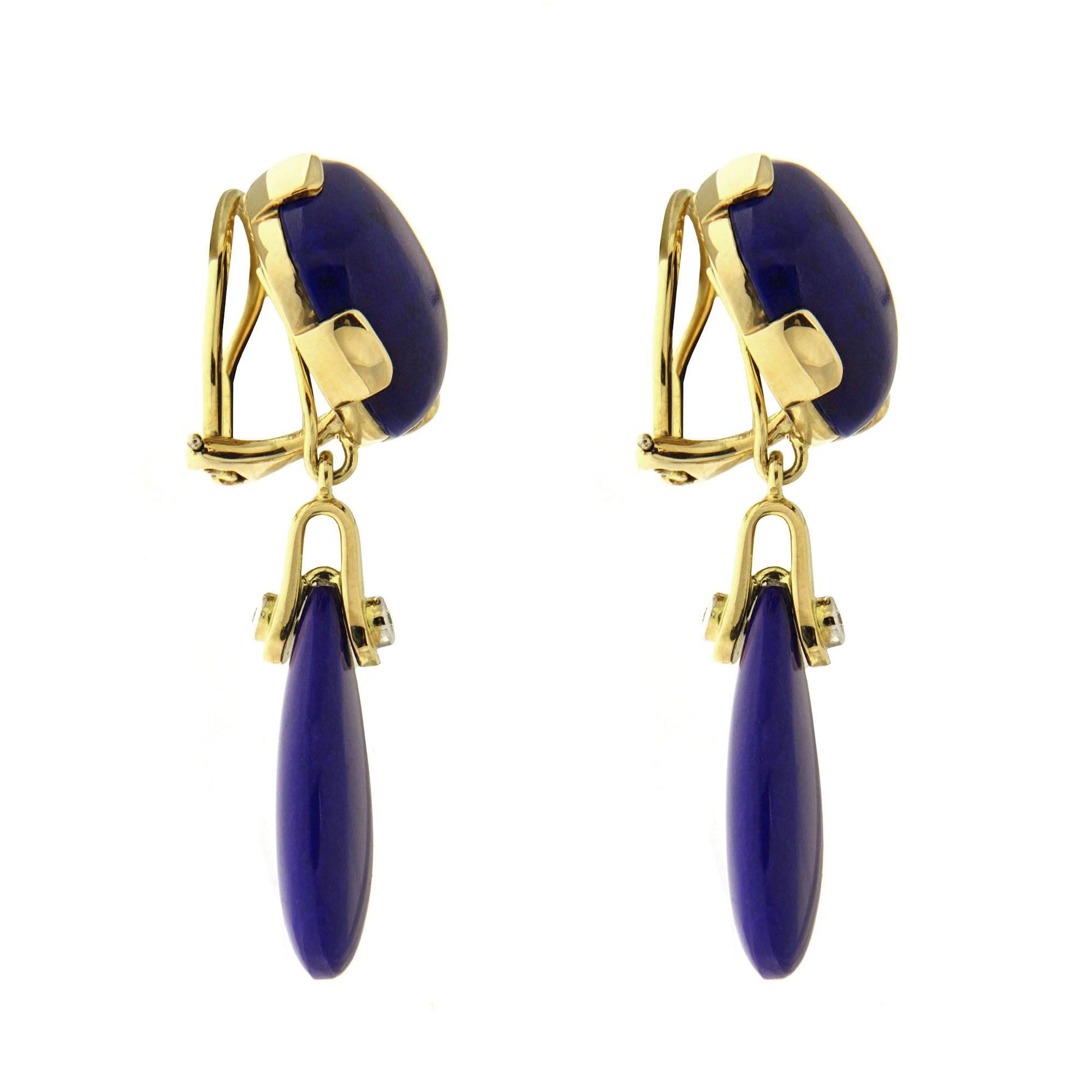 This unique pair of earrings features cushion cabochon Lapis Lazuli top with tear drop Lapis and diamond in 18kt yellow gold with Clip back (post can be added on upon request)