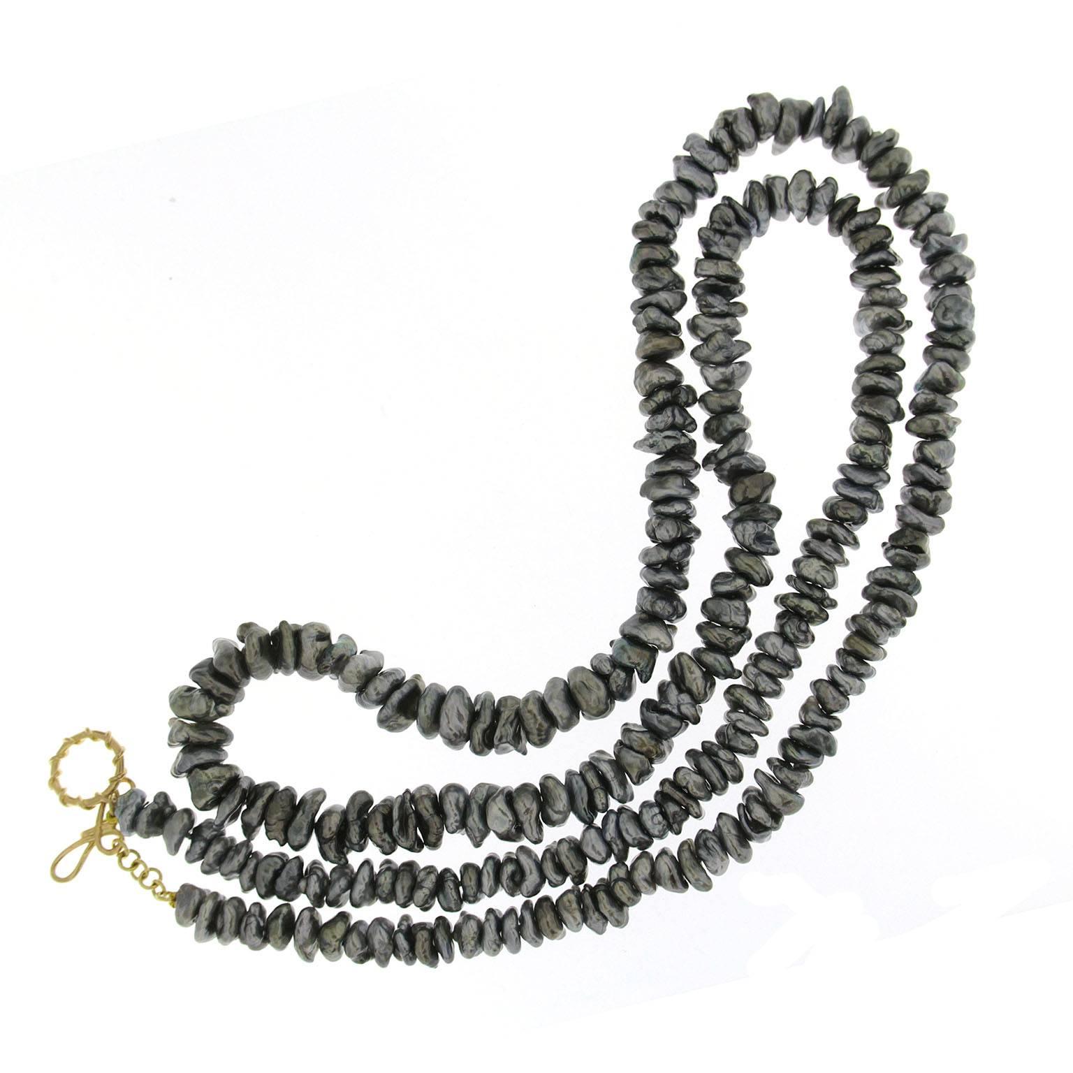 This necklace features Keshi Tahitian baroque pearls with 18kt yellow gold clasp of knot clasp ring and and toggle.