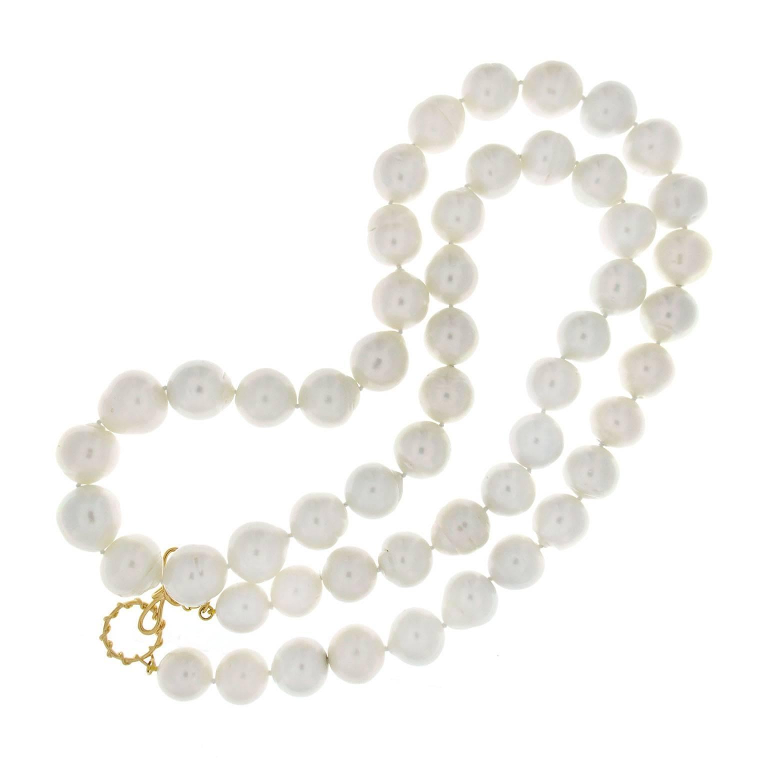 This exquisite necklace features 53 Baroque South Sea pearls ranging from  18.1 x  15.0mm. The necklace is 37 inches long with 18K yellow gold knot ring and toggle.
