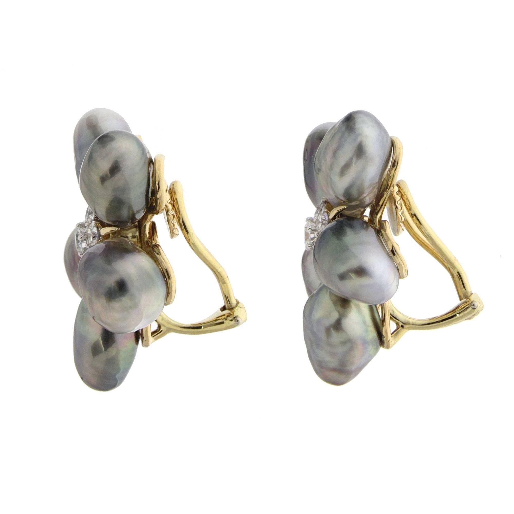 Cluster earrings with Silver Grey Keshi pearls and diamonds in the center, they are made in 18kt yellow gold and finished with clip backs.
