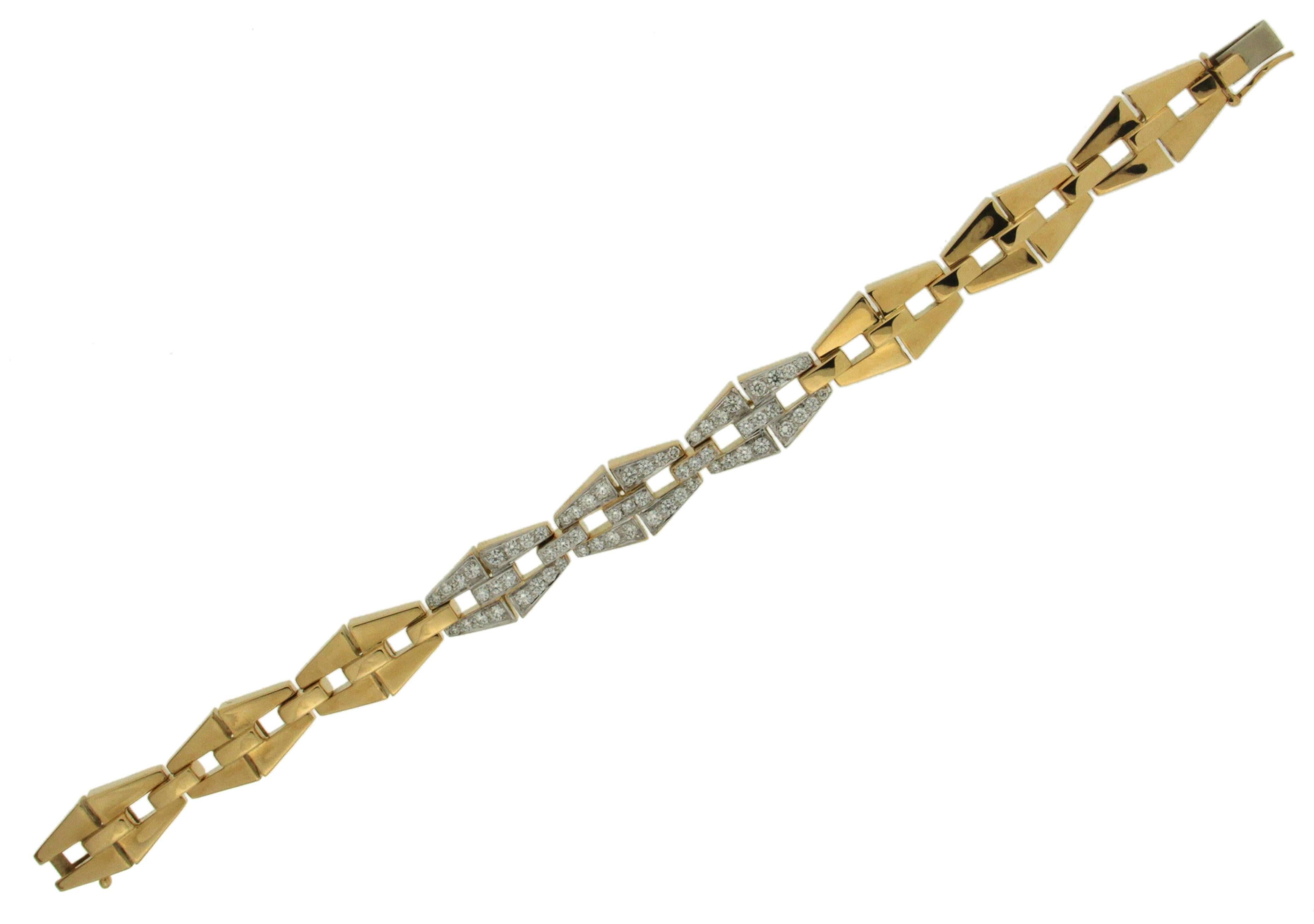 Valentin Magro is the artisan creating this bracelet, flexible with geometric trapezoid sections linked together, three of the center sections are covered by round brilliant pave set diamonds. The bracelet is finished in 18kt yellow gold. Diamonds