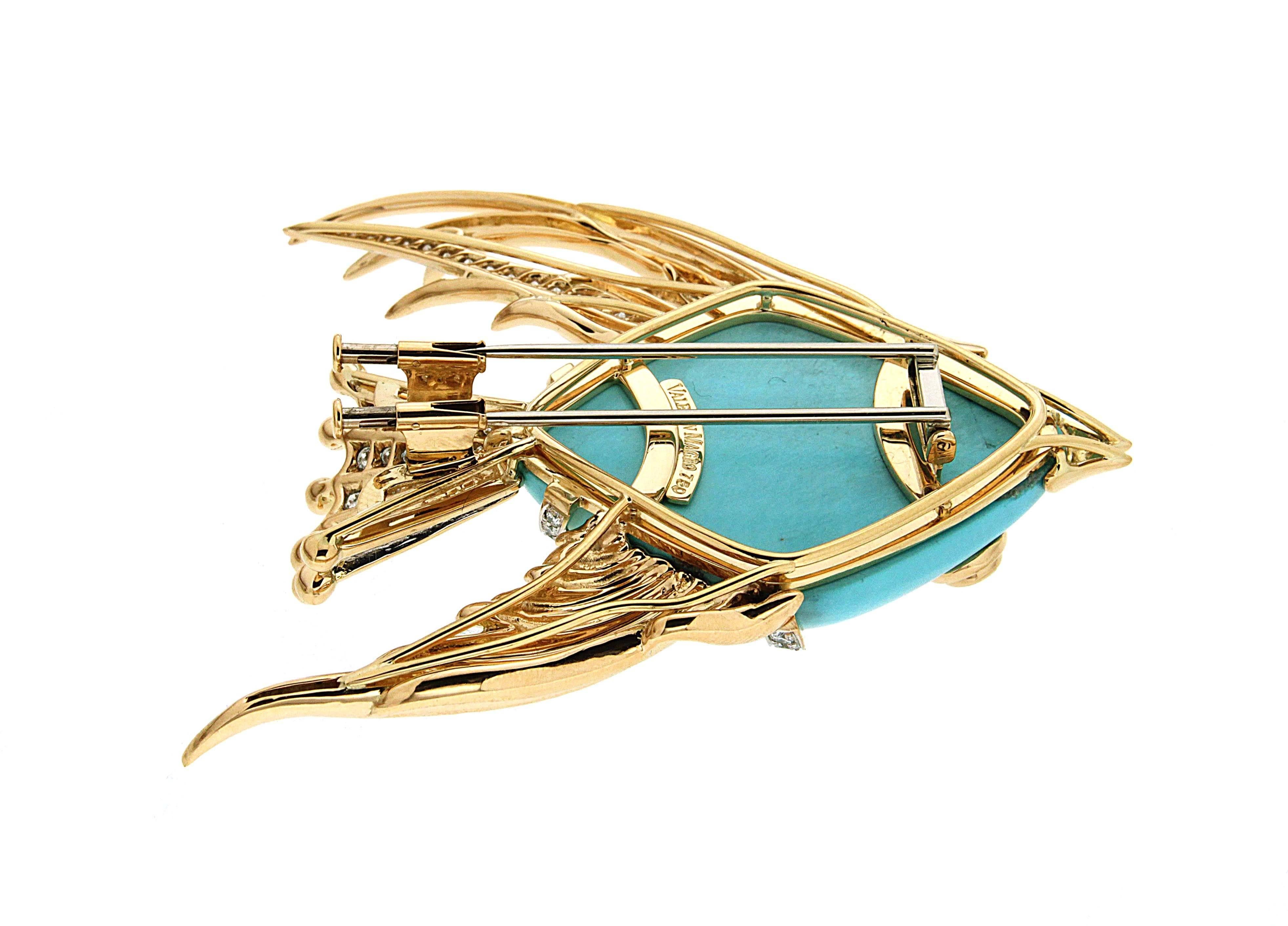 This lovely fish brooch is made in 18kt yellow gold and platinum with special cut turquoise and 2.63 carat total weight of round brilliant diamonds.