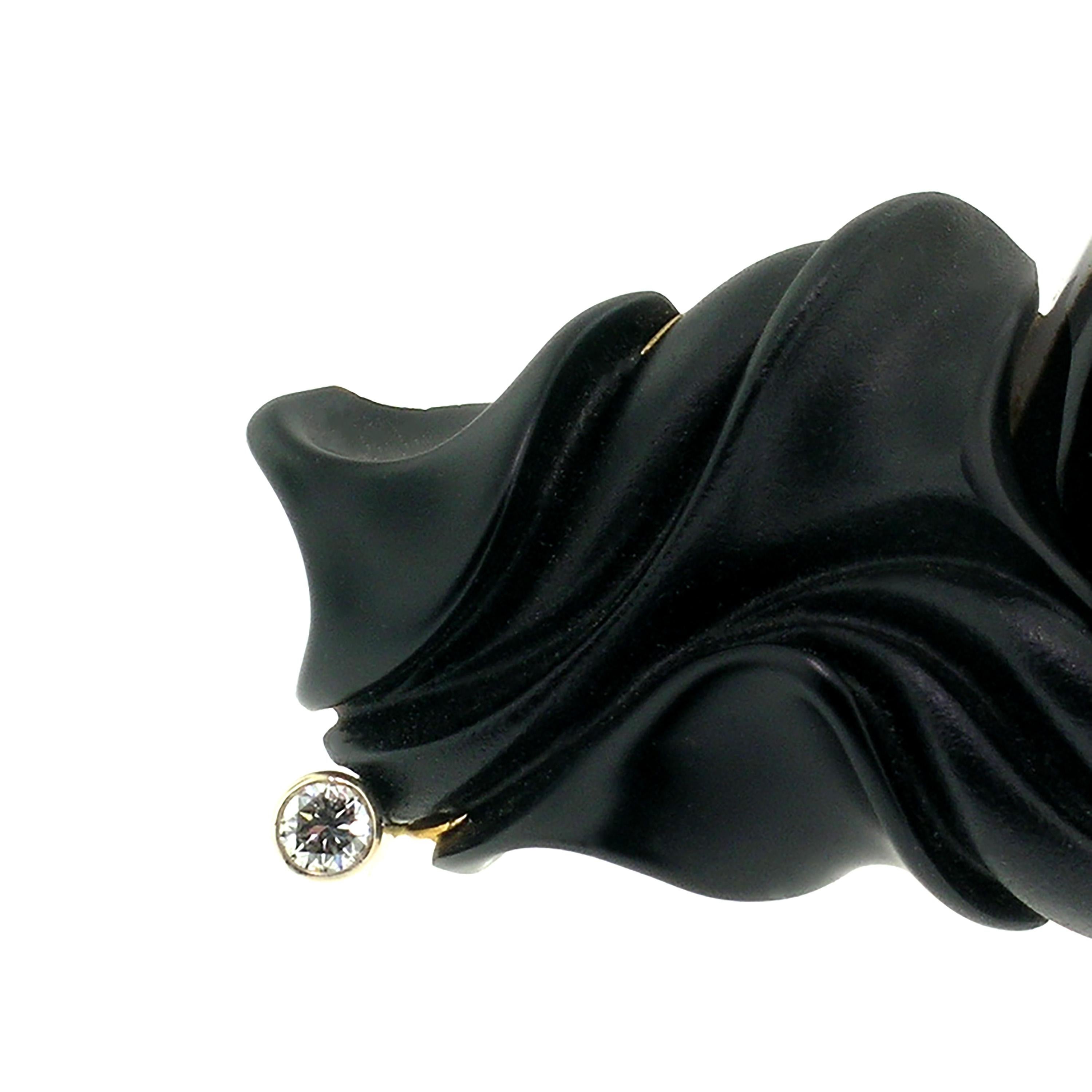 Unique style and elegance abound in this wearable ART Guyon designed piece of jewelry. The natural black chalcedony sculpture by Steve Walters gracefully folds around the gorgeously plumed fan of Montana agate. 

The hand-fabricated 18kt mounting