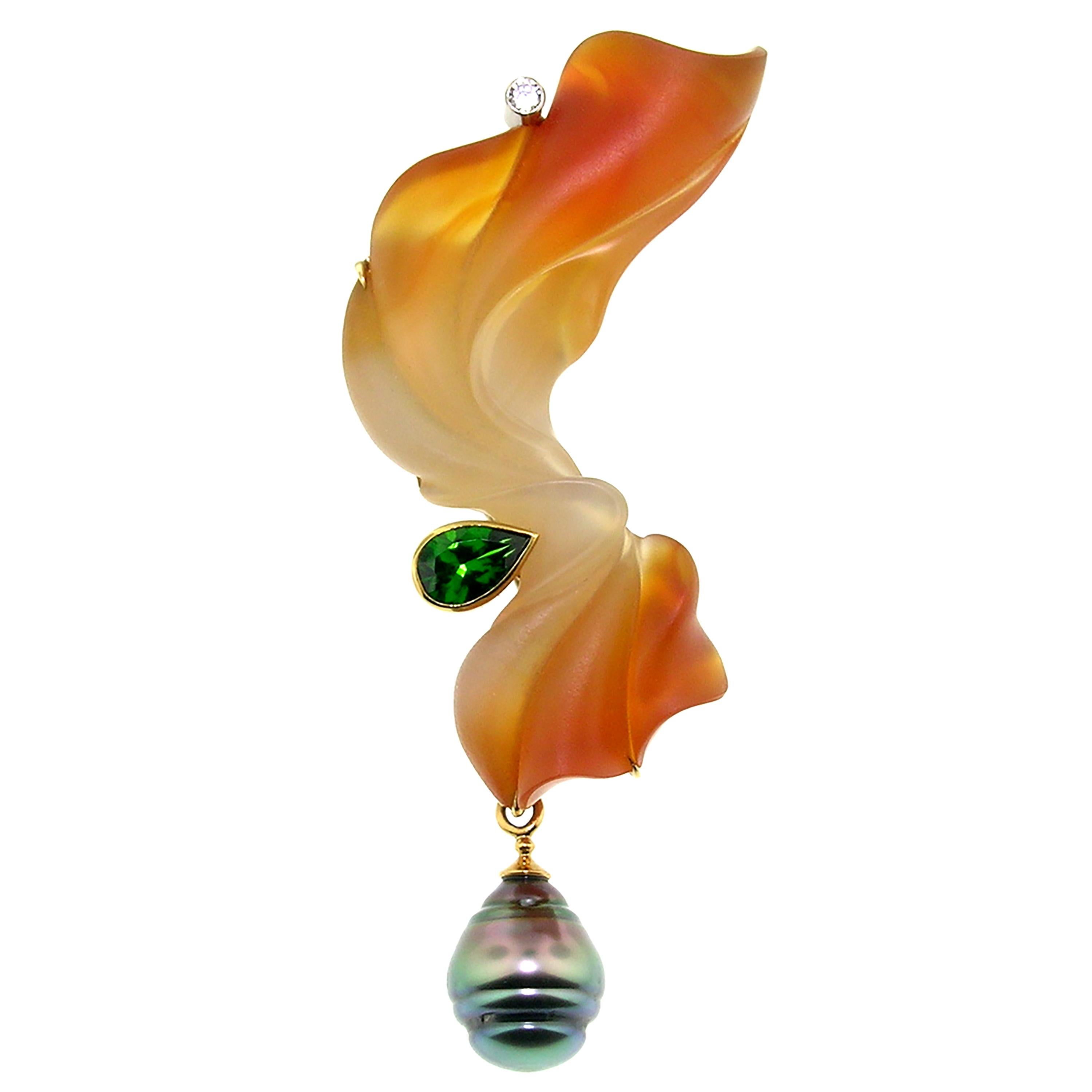 This is a high impact piece of jewelry which will leave an impression whenever and however you wear it. The variegated color of this exquisite carnelian was perfectly incorporated into this carving by master lapidary artist Steve Walters. A very