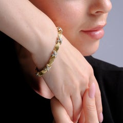 Pulsera de los años 80 con eslabones en forma de «X» de oro amarillo de 14k con diamantes, peso total de 1 quilate