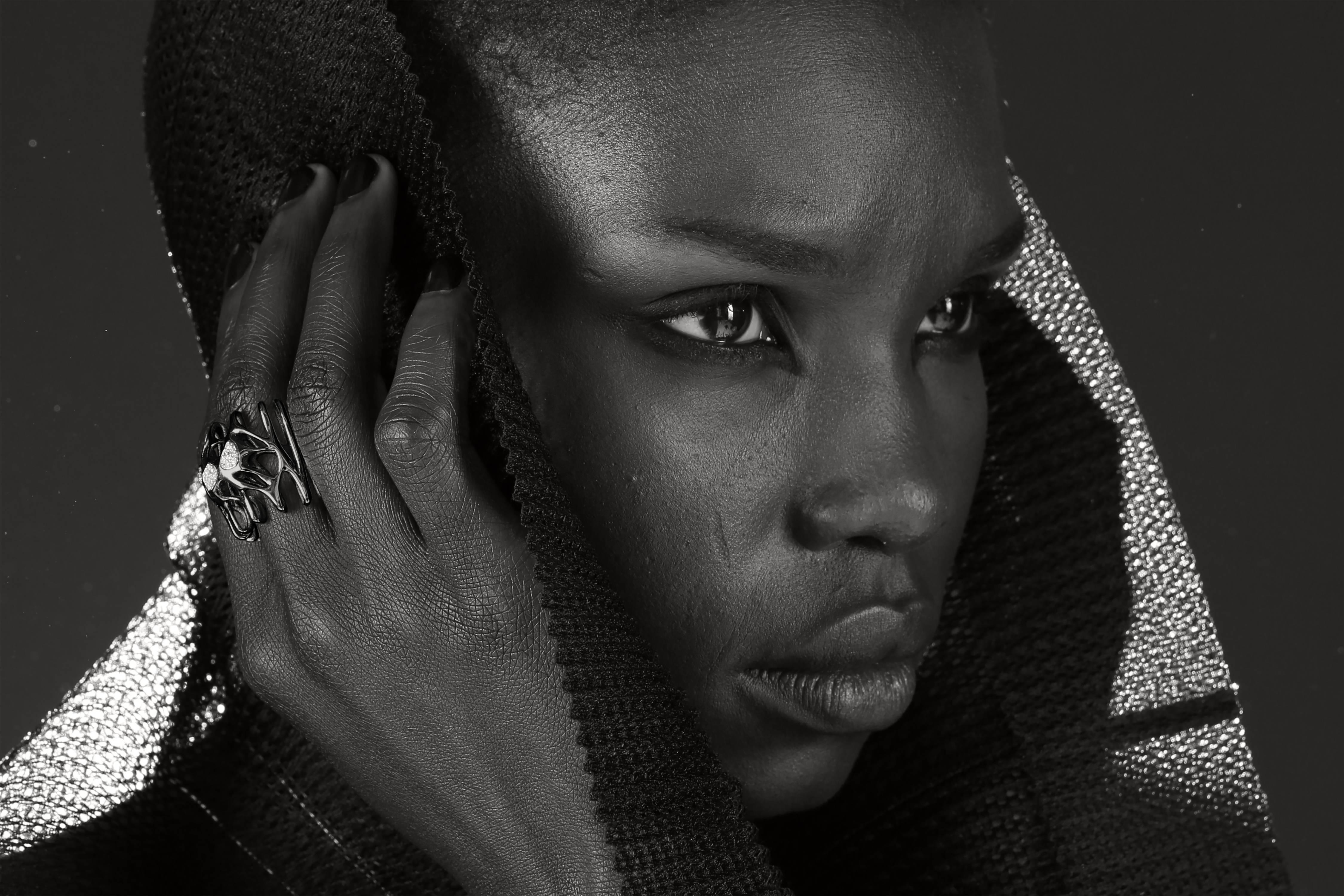 The RADIX Cocktail Ring is impossibly detailed, forming delicate webs that all at once seem half biological, half geological and all otherworldly.
Thin ribs and loops seem to grow around diamonds like metal fingers of coral, turning in on themselves