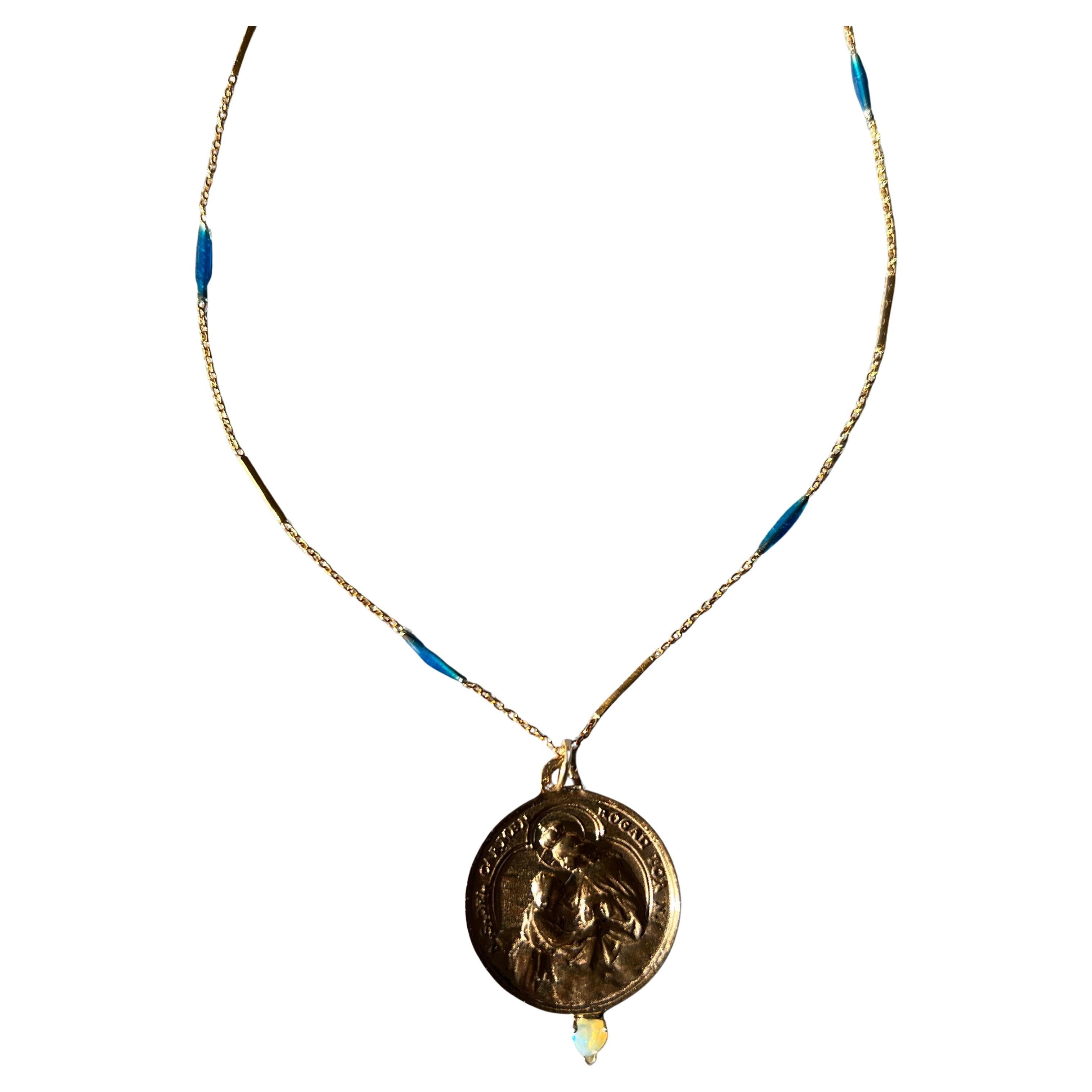 Blue Enamel Necklace Medal Egyptian Opal Heart Spanish Carmel

Designer: J Dauphin

Material: Goldplated, enamelled Chain and Bronze medal.

The Chain is 28 Inches long and has blue enamel handpainted.

Symbols or medals can become a powerful tool