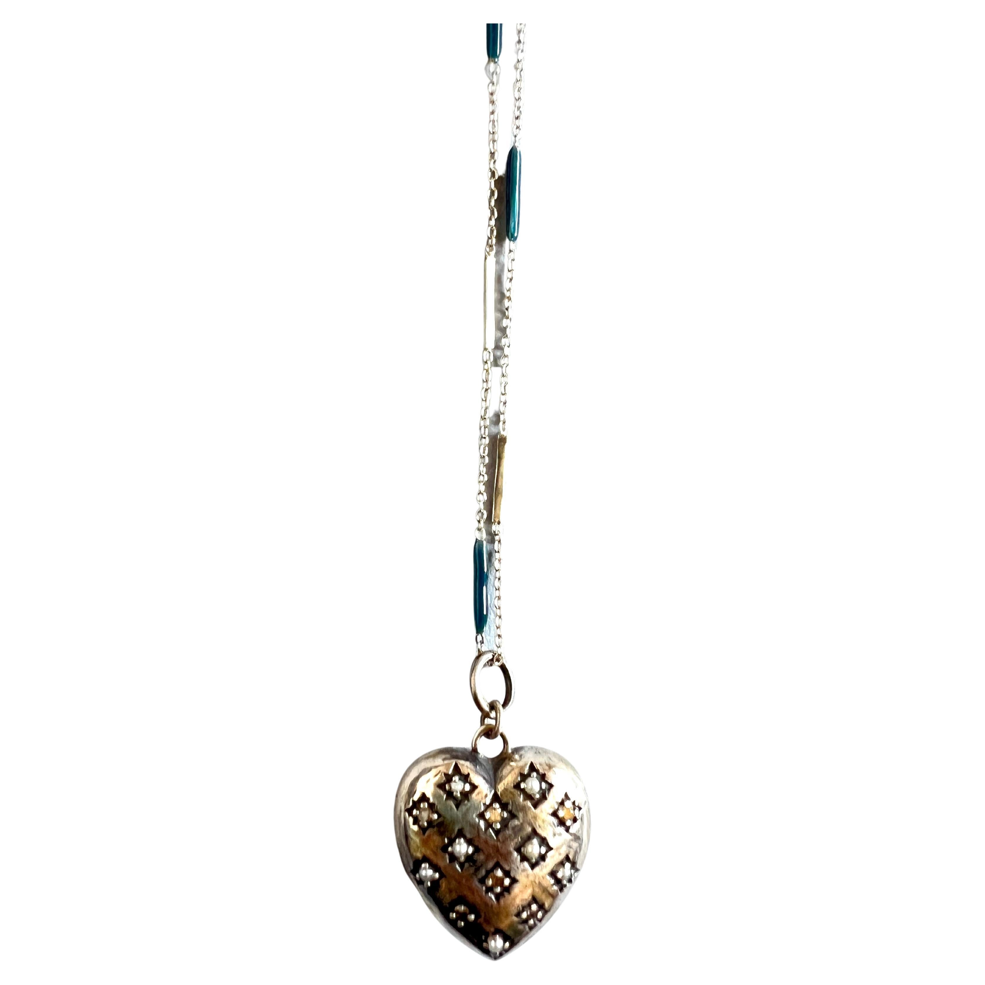 Silver Heart Necklace Victorian Style White Diamond Pearl 

Chain: Solid Sterling Silver
Heart: Solid Sterling Silver

Designer: J DAUPHIN

Length: 28 inches 

White diamonds hold significant spiritual meaning by embodying purity, clarity, and