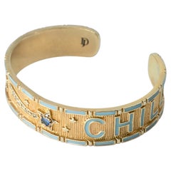 Bracciale a polsino “Divine Child” con zaffiro blu, diamanti, stella cadente, smalto blu e oro
