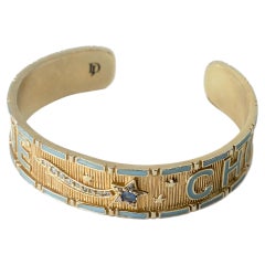 Bracciale a polsino “Divine Child” con zaffiro blu, diamanti, stella cadente, smalto blu e oro
