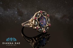 Black Opal Ring Surrounded by Black Star Sapphires, Diamonds and Burmese Rubies