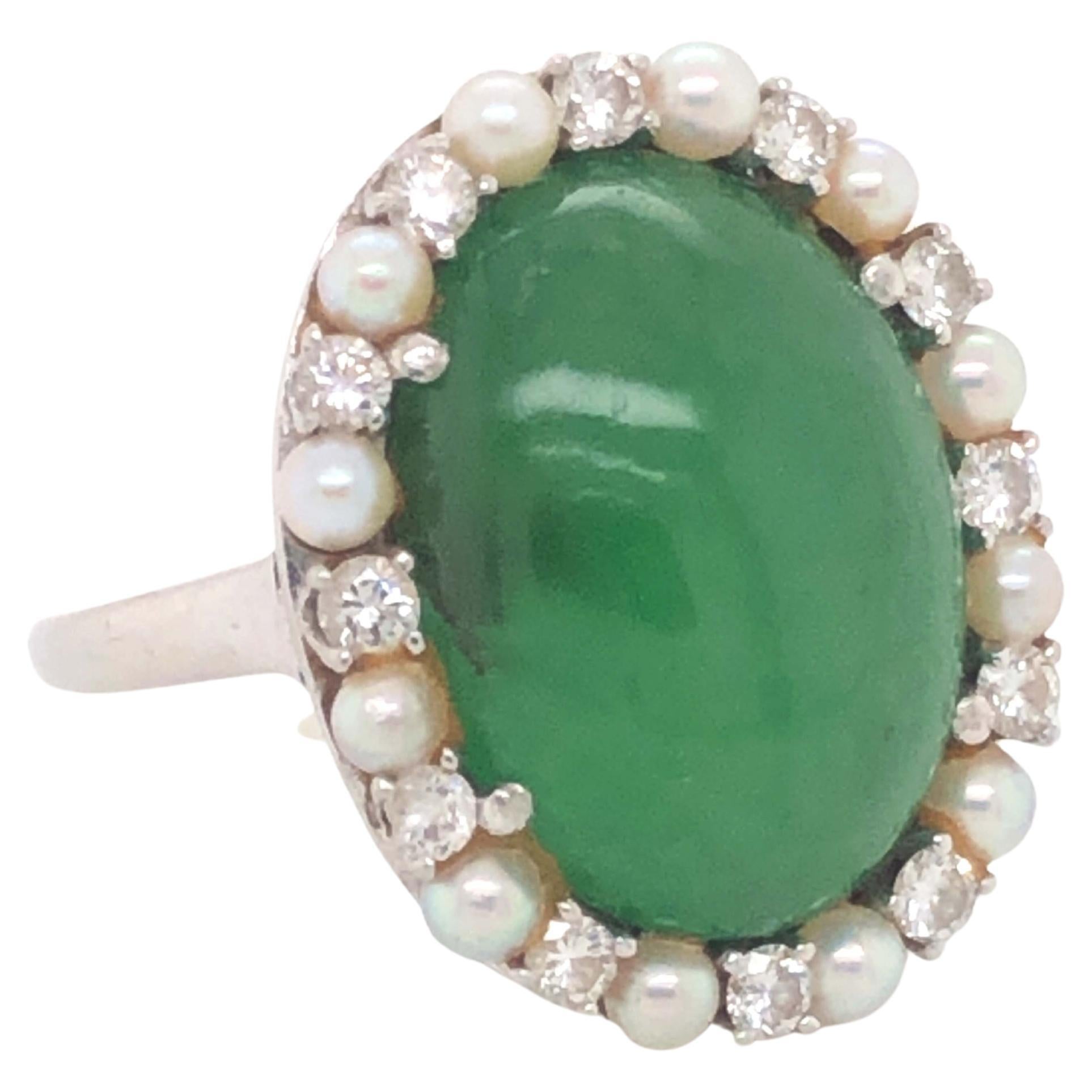 Vintage Oval Double Cabochon Green Jadeite Jade Pearl and Diamond Halo Ring in Platinum. Oval shape double cabochon green jadeite jade with a pearl and diamond halo. Comes with GIA report #:5234035329. Order will include original GIA report. The