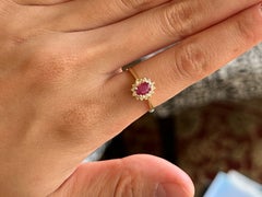 Vintage Oval Ruby and Diamond Halo Ring 14k Yellow Gold