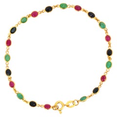 Bracciale in oro giallo 18 carati con rubini, zaffiri e smeraldi