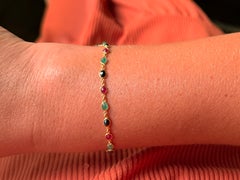 Bracciale in oro giallo 18 carati con rubini, zaffiri e smeraldi