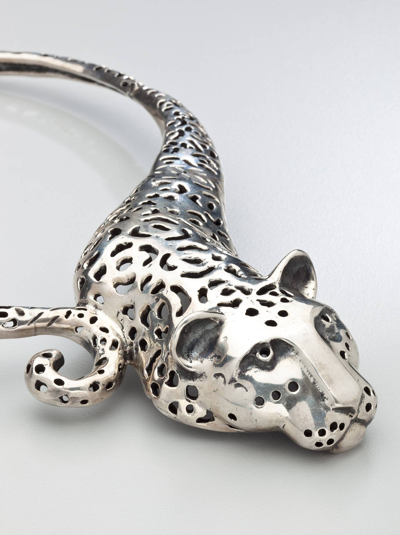 A sterling silver necklace designed as a jaguar by Emilia Castillo, the daughter of one of the original Los Castillo brothers who worked in Taxco. Mexico.  The necklace, which is constructed in silver segments, is pierced to simulate the pattern of
