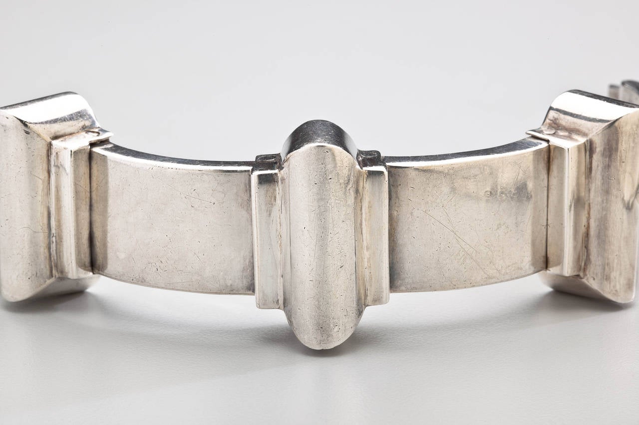 A sterling silver bracelet with strong geometric design by Mexican master silversmith, Antonio Pineda.  This rare bracelet, shows a strong Art Deco influence that pervades Antonio's work.  Signed with the Antonio crown mark, Taxco, Made in Mexico,