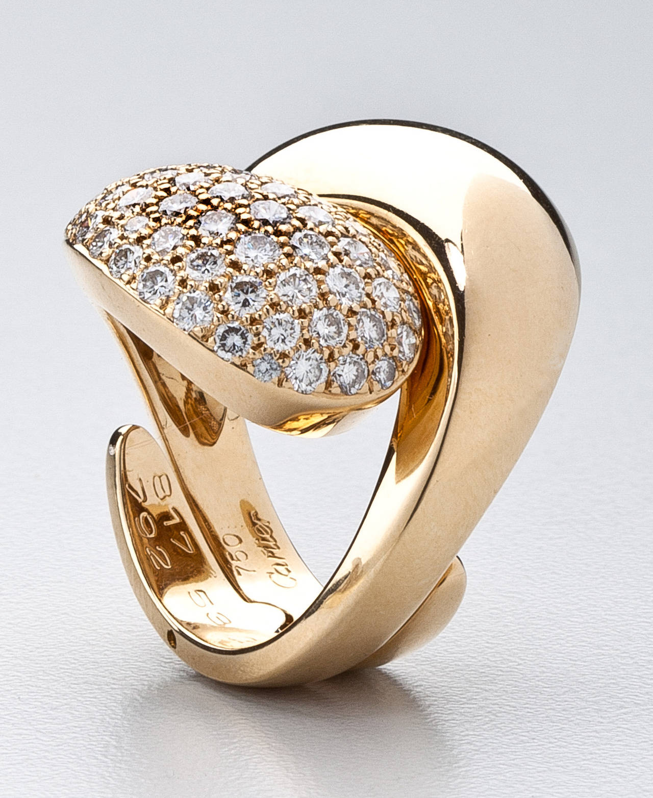 Modern Cartier Cross-Over diamond gold band ring