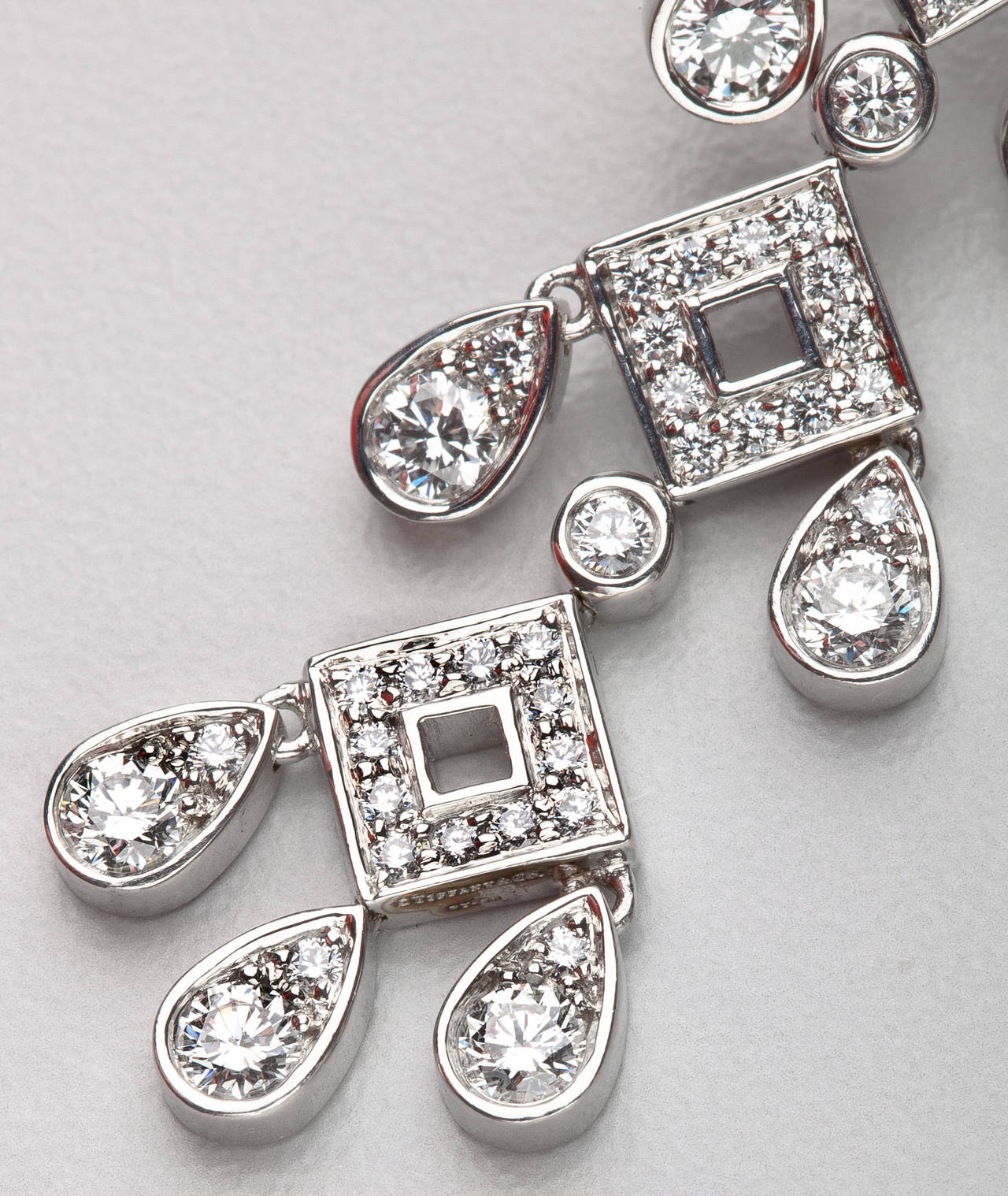 An elegant pair of platinum and diamond earrings by Tiffany & Co. from their 