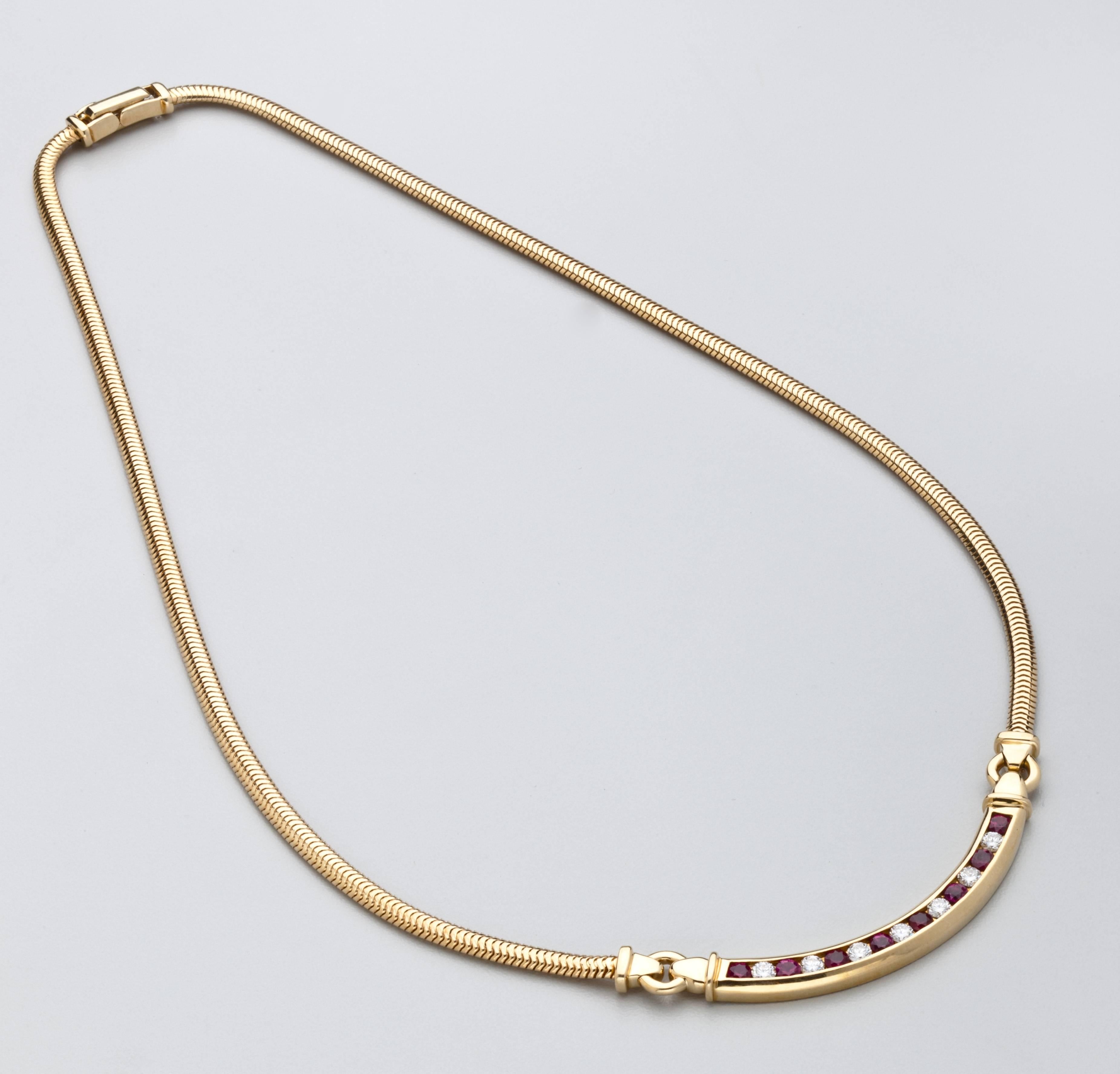 A classic Tiffany necklace in 18 karat gold with eight deep red rubies and  seven full cut diamonds on a strap chain.  Approximately .90 carats diamonds.  Signed Tiffany & Co. 750 .  