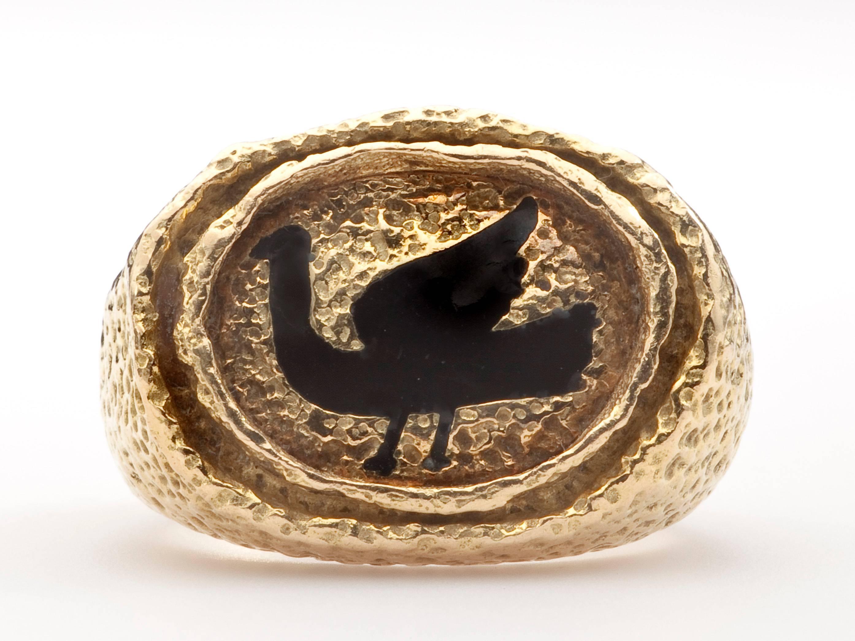 A 22 karat gold ring by artist, Georges Braque (1882 - 1963) showing the Greek mythological figure, Procris.  The high karat gold ring has a textured surface highlighted by a black enamel figure.   Braque turned to designing jewelry in the last two