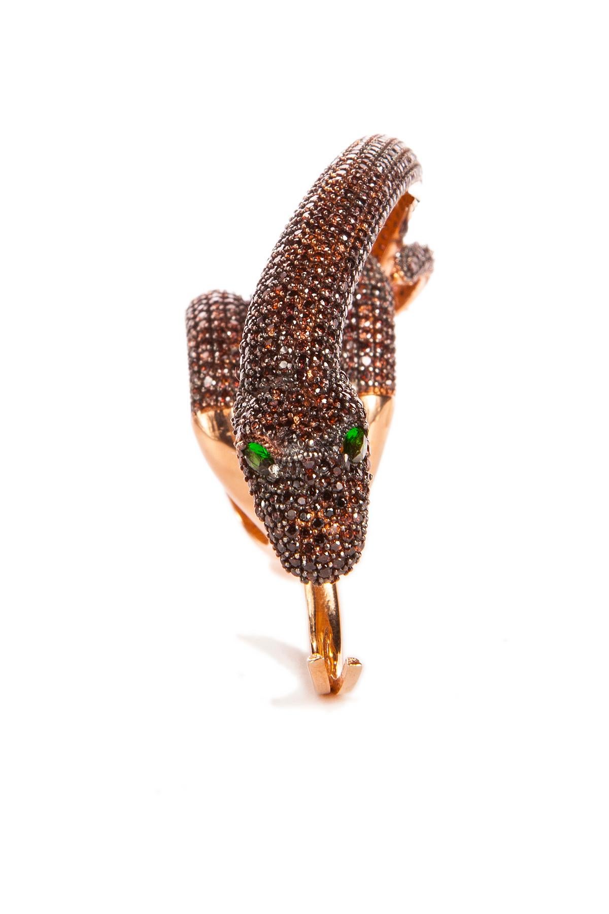 A gorgeous statement ring not for a faint in heart! Hand crafted two fingers snake ring. 18K rose gold or yellow gold plated sterling silver. Hand set with pave cubic zircon. Adjustable in size.