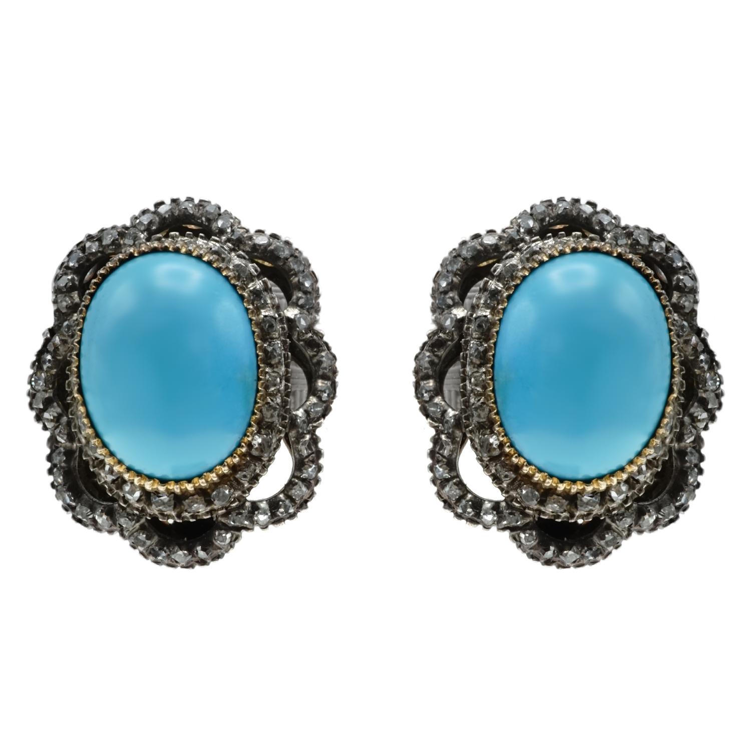 Crafted in 18 karat and silver featuring 2 Sleeping Beauty Persian Turquoise oval cabochons measures 13.00 x 9.90 mm  surrounded by rose and french cut diamonds.  Weight 15.2 gr./9.8 dwt. 

Diamond:  Estimated weight 1.25 - 1.50 carats
Earring
