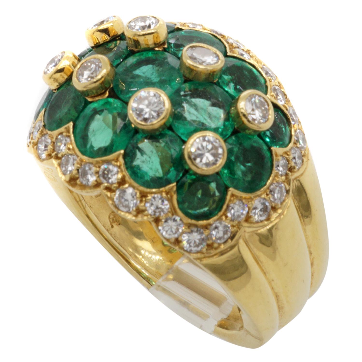 Van Cleef & Arpels Emerald Diamond 18 Karat yellow gold ring featuring 15 round modified brilliant cut vivid green emeralds and 44 round brilliant cut diamonds.  Signed Van Cleef & Arpels N.Y. 56393 stamped 18k 750 with hallmarks.  Ring size 7. 