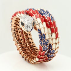 Bracciale Alexis NY con diamanti, zaffiri e smalto, in oro 18 carati e argento, con motivo a serpente intrecciato