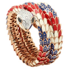 Bracciale Alexis NY con diamanti, zaffiri e smalto, in oro 18 carati e argento, con motivo a serpente intrecciato