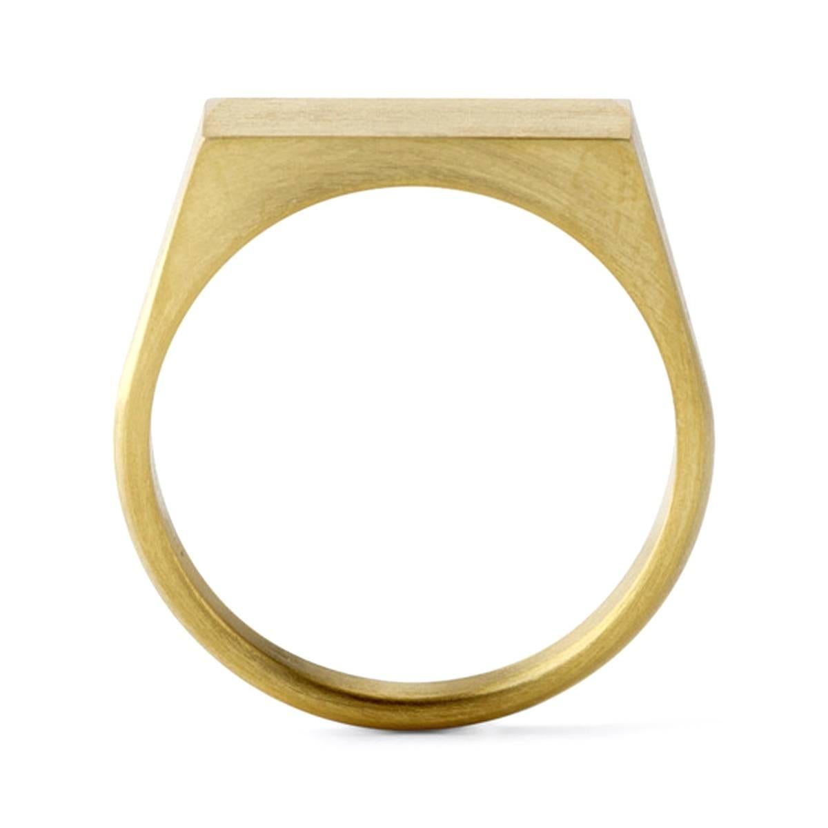 A classic rectangular signet ring made of 18 karat yellow gold. The signet surface and inside the ring band is polished in contrast with the surface of the ring band which is matte. 

Signet top measurements: 14mm x 7.5mm
This item is
